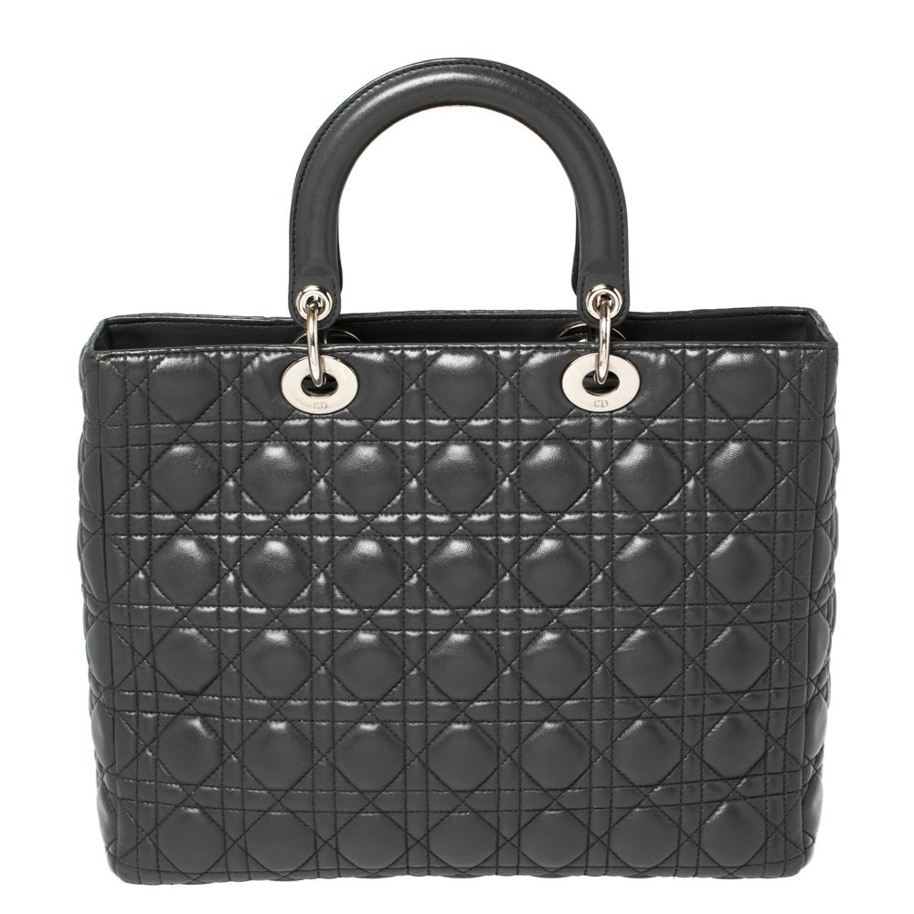One of the most epochal creations by Dior is the Lady Dior tote! Made in many different versions, this bag has stood the test of time and is an ageless creation to own. This iteration is made from leather in its signature Cannage pattern, inspired