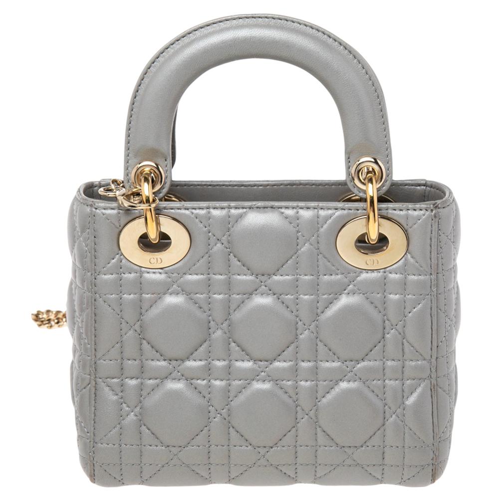The Lady Dior tote is a Dior creation that has gained recognition worldwide and is today a coveted bag that every fashionista craves to possess. This grey tote has been crafted from leather and it carries the signature Cannage quilt. It is equipped