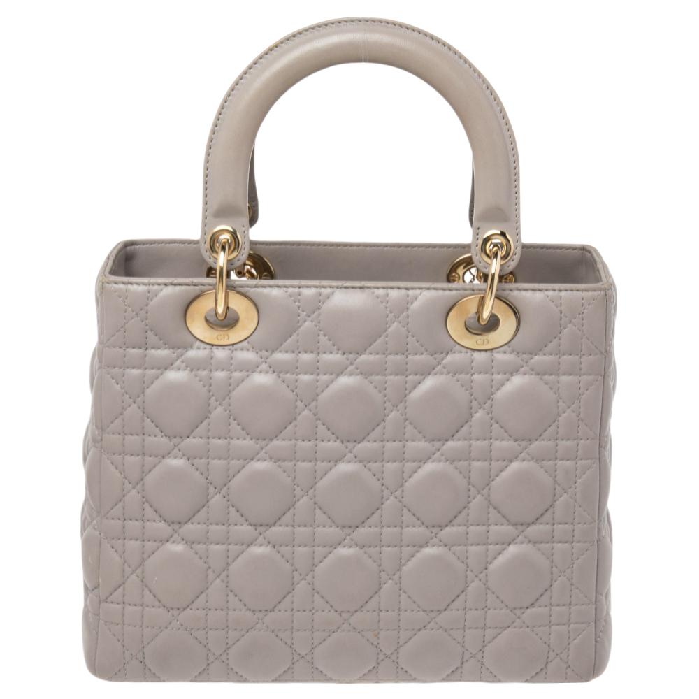 The Lady Dior tote is a Dior creation that has gained recognition worldwide and is today a coveted bag that every fashionista craves to possess. This tote has been crafted from leather and it carries the signature Cannage quilt. It is equipped with