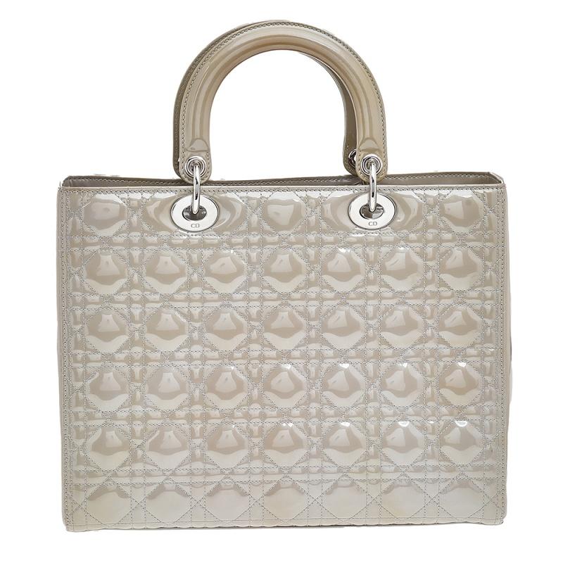 The Lady Dior tote is a Dior creation that has gained recognition worldwide and is today a coveted bag that every fashionista craves to possess. This grey tote has been crafted from patent leather and it carries the signature Cannage quilt. It is