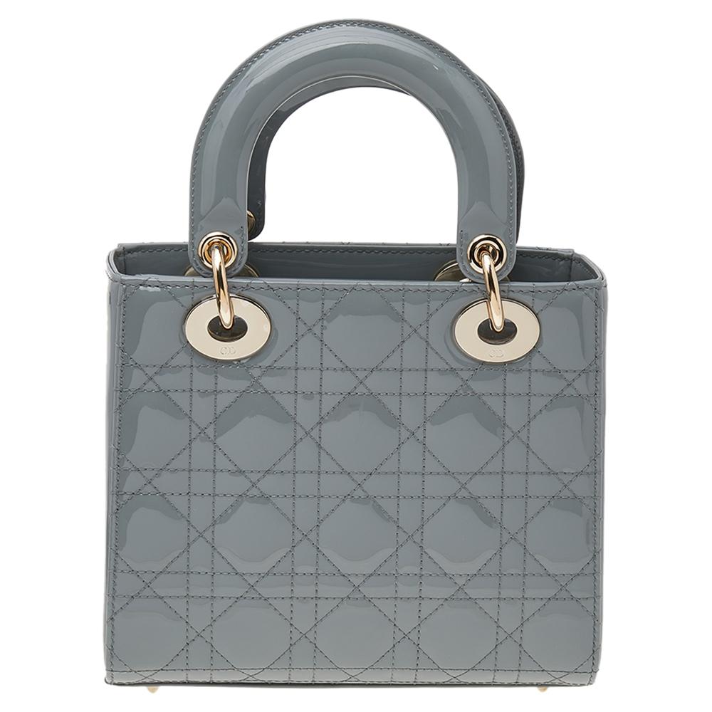 The Lady Dior tote is a Dior creation that has gained recognition worldwide and is today a coveted bag that every fashionista craves to possess. This grey tote has been crafted from patent leather and it carries the signature Cannage quilt. It is