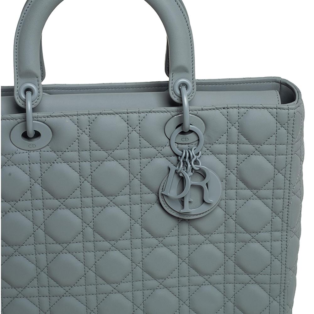 The Lady Dior tote is a Dior creation that has gained recognition worldwide and is today a coveted bag that every fashionista craves to possess. This grey tote has been crafted from ultra-matte leather and it carries the signature Cannage quilt. It