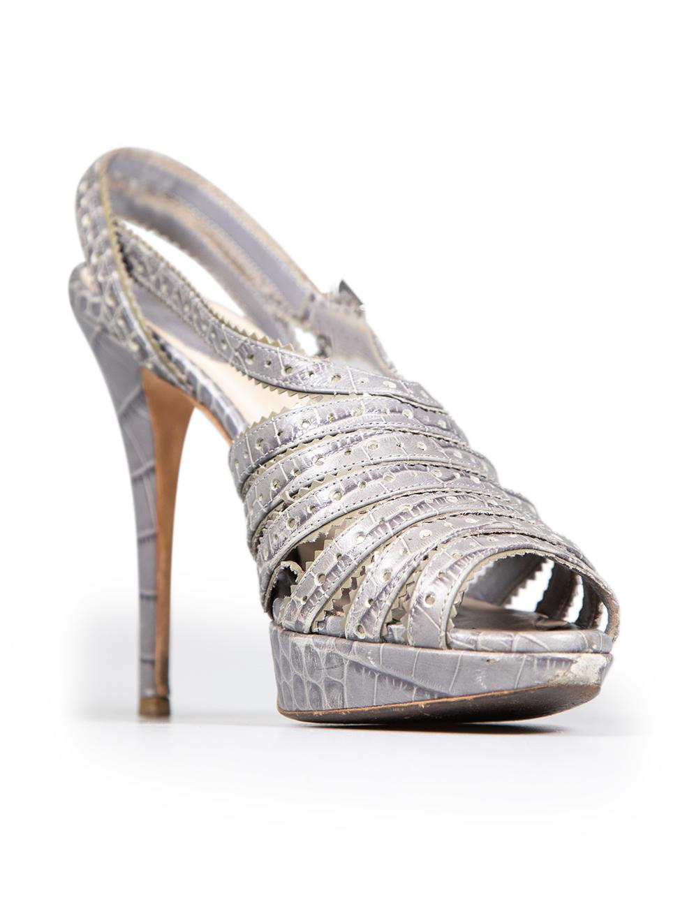 CONDITION is Good. Minor wear to sandals is evident. Light signs of wear to the insoles and abrasions to the tips of both shoes. Light scratches on the heel of the right shoe and general wear to the heel tips of both shoes on this used Dior designer