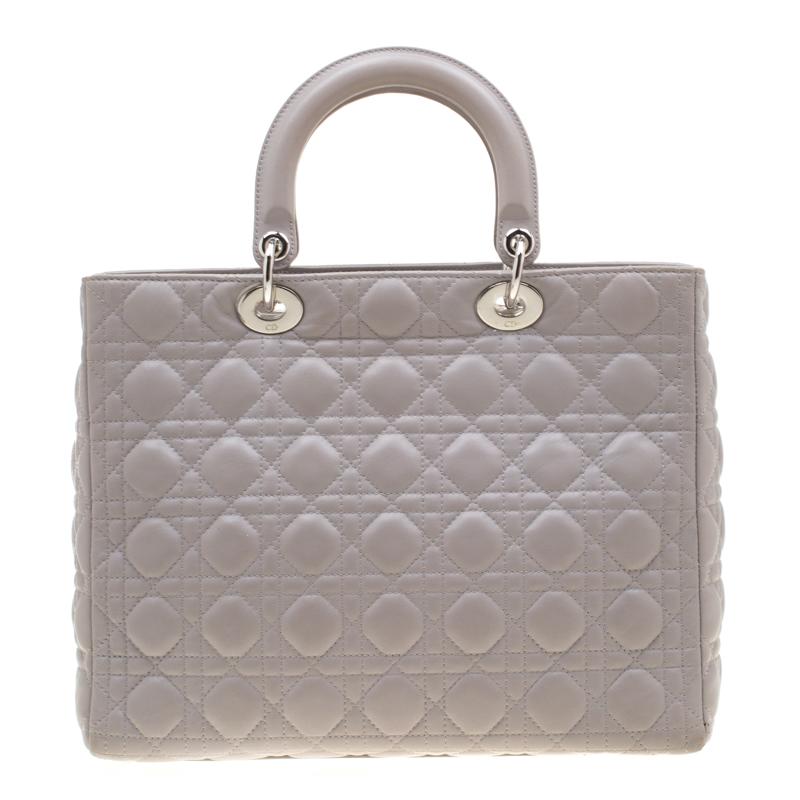 The Lady Dior tote is a Dior creation that has gained recognition worldwide and is today a coveted bag that every fashionista craves to possess. This grey tote has been crafted from leather and it carries the signature Cannage quilt. It is equipped