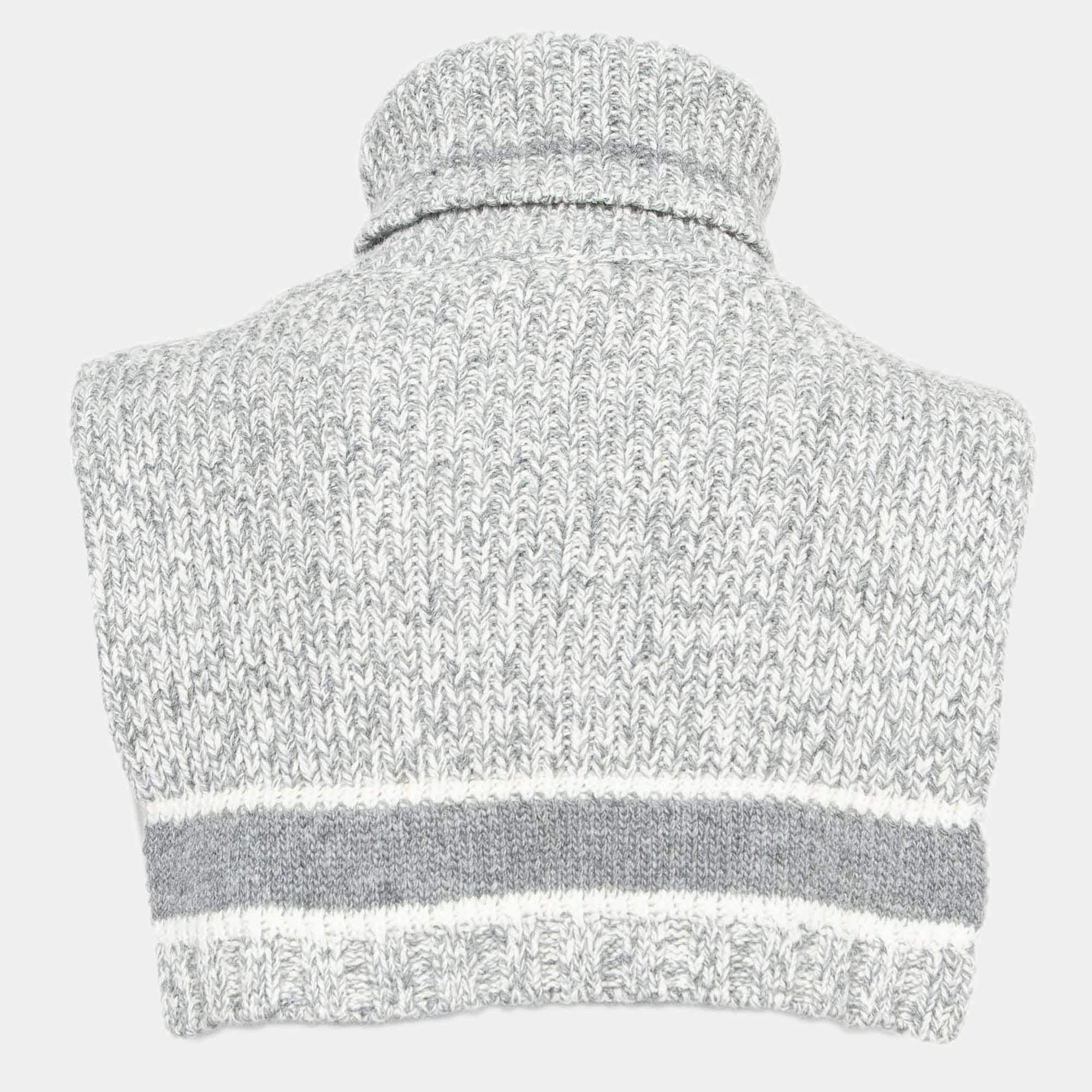 Embrace luxury with the Dior neck warmer. Crafted with meticulous attention to detail, this accessory exudes understated refinement. The iconic Dior logo subtly integrated into the ribbed knit design adds a touch of timeless elegance to your winter