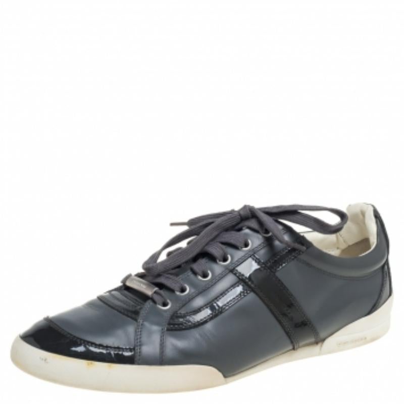 Who does not need a pair of simple, casual, and stylish sneakers! These Dior ones check all the style boxes and will assist you in creating a fashionable look. They are crafted from patent leather and leather in a grey shade into a classic