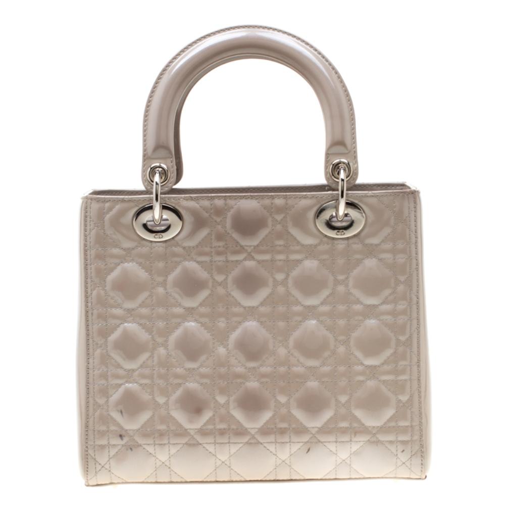 The Lady Dior tote is a Dior creation that has gained recognition worldwide and is today a coveted bag that every fashionista craves to possess. This grey tote has been crafted from patent leather and it carries the signature Cannage quilt. It is