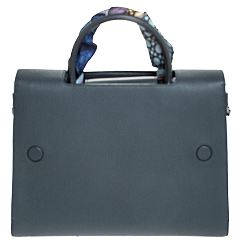 Every stitch and detail on this Diorever bag gives high praise to quality craftsmanship and validates the painstaking effort that goes into making a handbag art as fine as this. Structured to perfection using the finest leather and designed with a