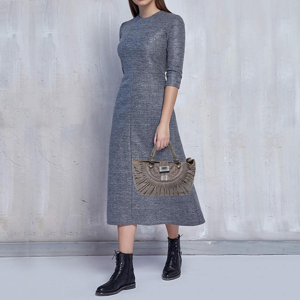 This alluring tote bag for women has been designed to assist you on any day. Convenient to carry and fashionably designed the tote is cut with skill and sewn into a great shape. It is well equipped to be a reliable accessory.