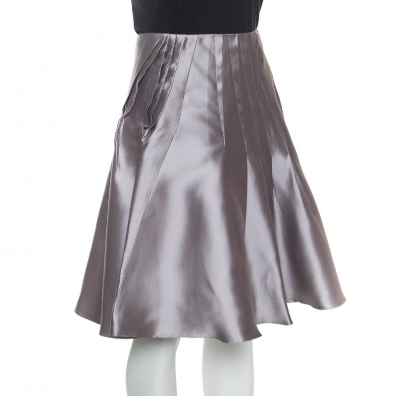 How lovely is this grey skirt from Dior! It is designed from silk as a high waist and detailed with pleats and a flared shape. Assemble this creation with a black blouse and slingback sandals for a winning look.

Includes: The Luxury Closet