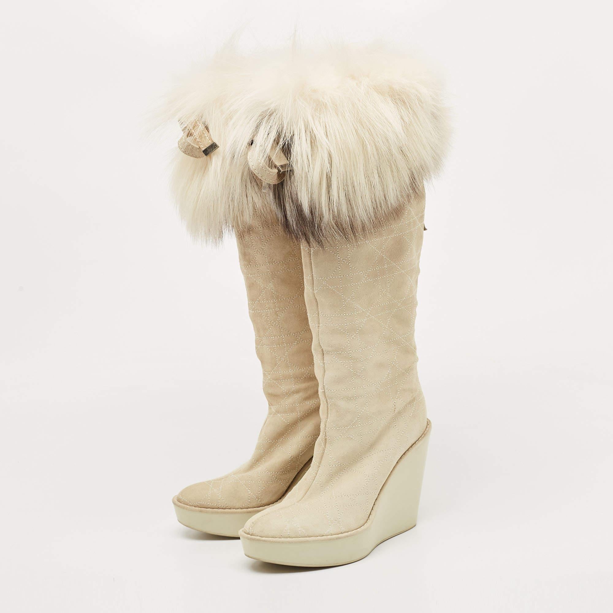 From the mega brand Dior comes this pair of boots that has been crafted from suede and designed with their Cannage quilt and fox fur trims with ties on the uppers. The boots are also embellished with crystal D charms on the back and they're balanced