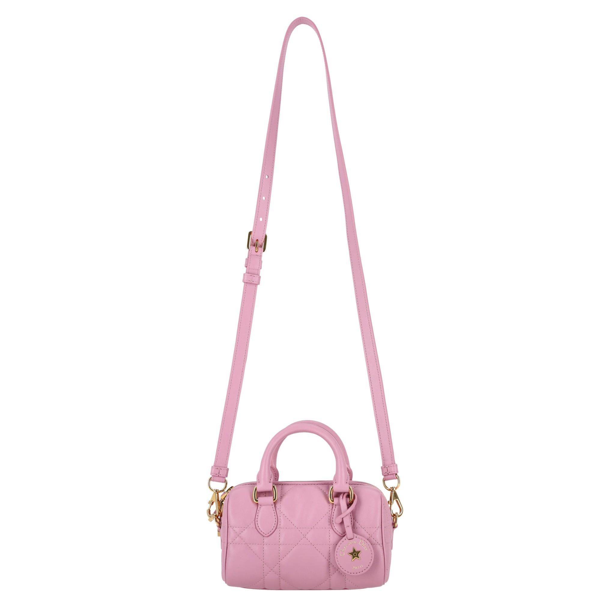 Current Season - Dior Groove 17 Nano Calfskin Leather Bag

Hydrangea pink bag designed by Maria Grazia Chiuri with Macrocannage quilted effect.

Detailed with matte gold hardware and round leather branded tag.

Featuring dual top handle and