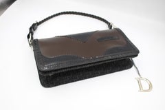Dior handbag in dark blue and brown patent leather.