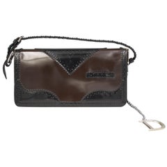 Dior handbag in dark blue and brown patent leather.