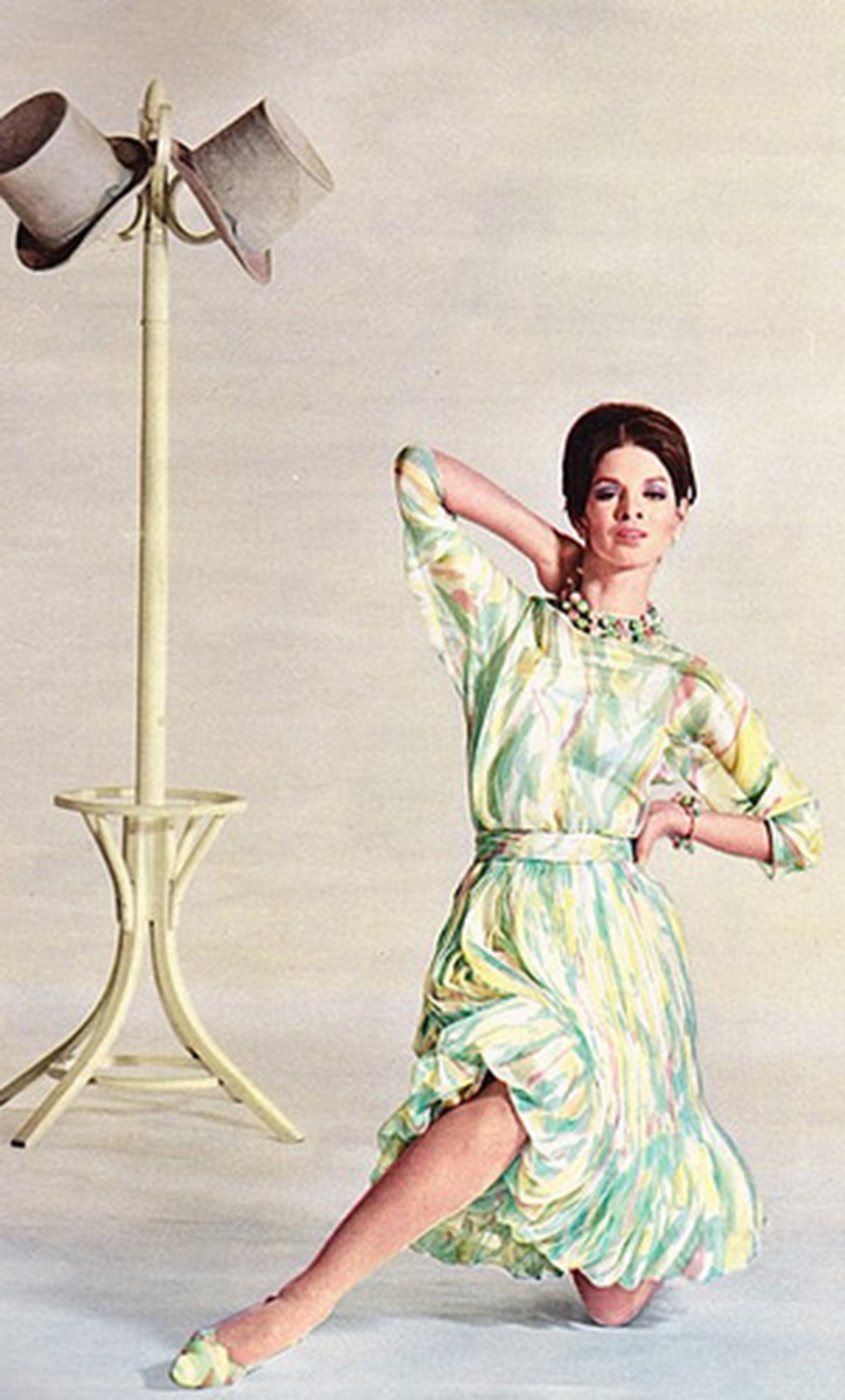A stunning piece of haute couture, this Marc Bohan by Dior dress was photographed for L’Officiel in 1965. Constructed in sheer silk chiffon in pastel shades of green, pink, yellow and ivory, the dress has a nude underdress with boned corset and the