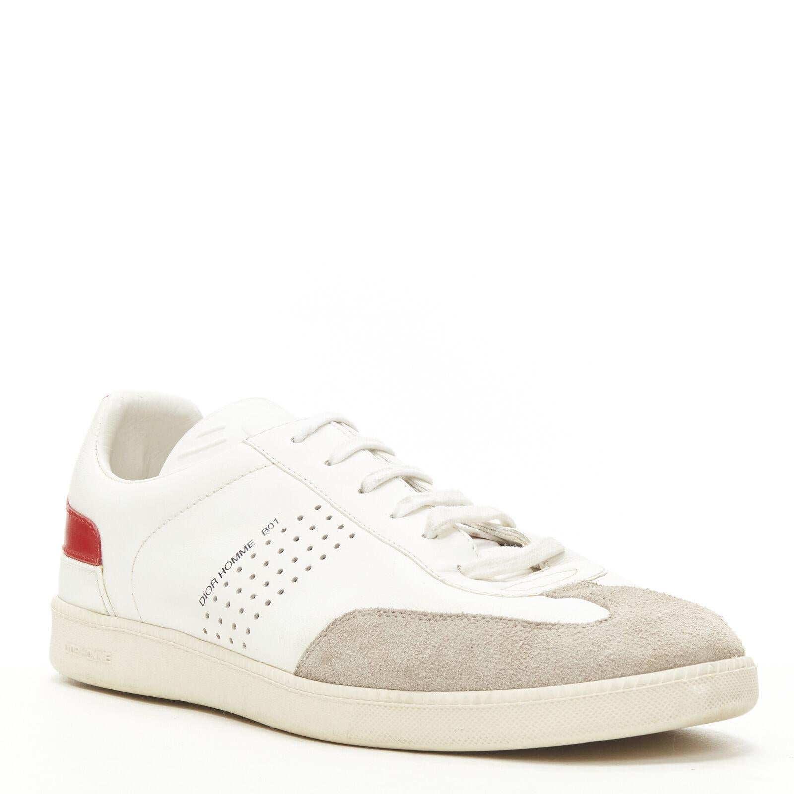 DIOR HOMME B01 white red Bee laether suede trim trainer sneaker EU38
Reference: JACG/A00053
Brand: Christian Dior
Model: B01
Material: Leather
Color: White, Red
Pattern: Solid
Closure: Lace Up

CONDITION:
Condition: Fair, this item was pre-owned and