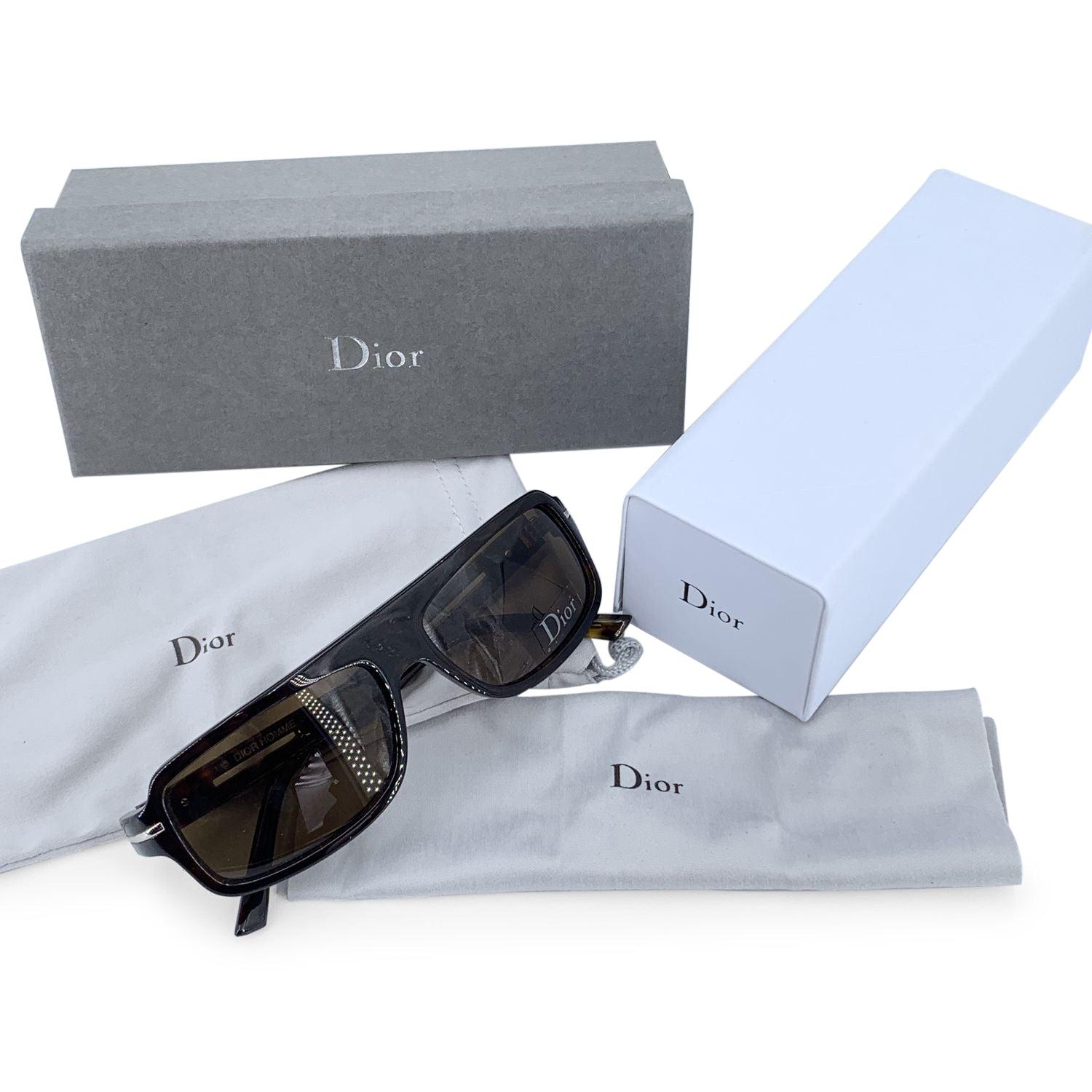 CHRISTIAN DIOR HOMME 'Black Tie' Sunglasses,mod. 70/S - 086EC. Size 56/15 - 135mm. Dark brown acetate frame, sides with silver metal accents on ear stems. 100% Total UVA/UVB protection brown lenses. Made in Italy. Details MATERIAL: Plastic COLOR: