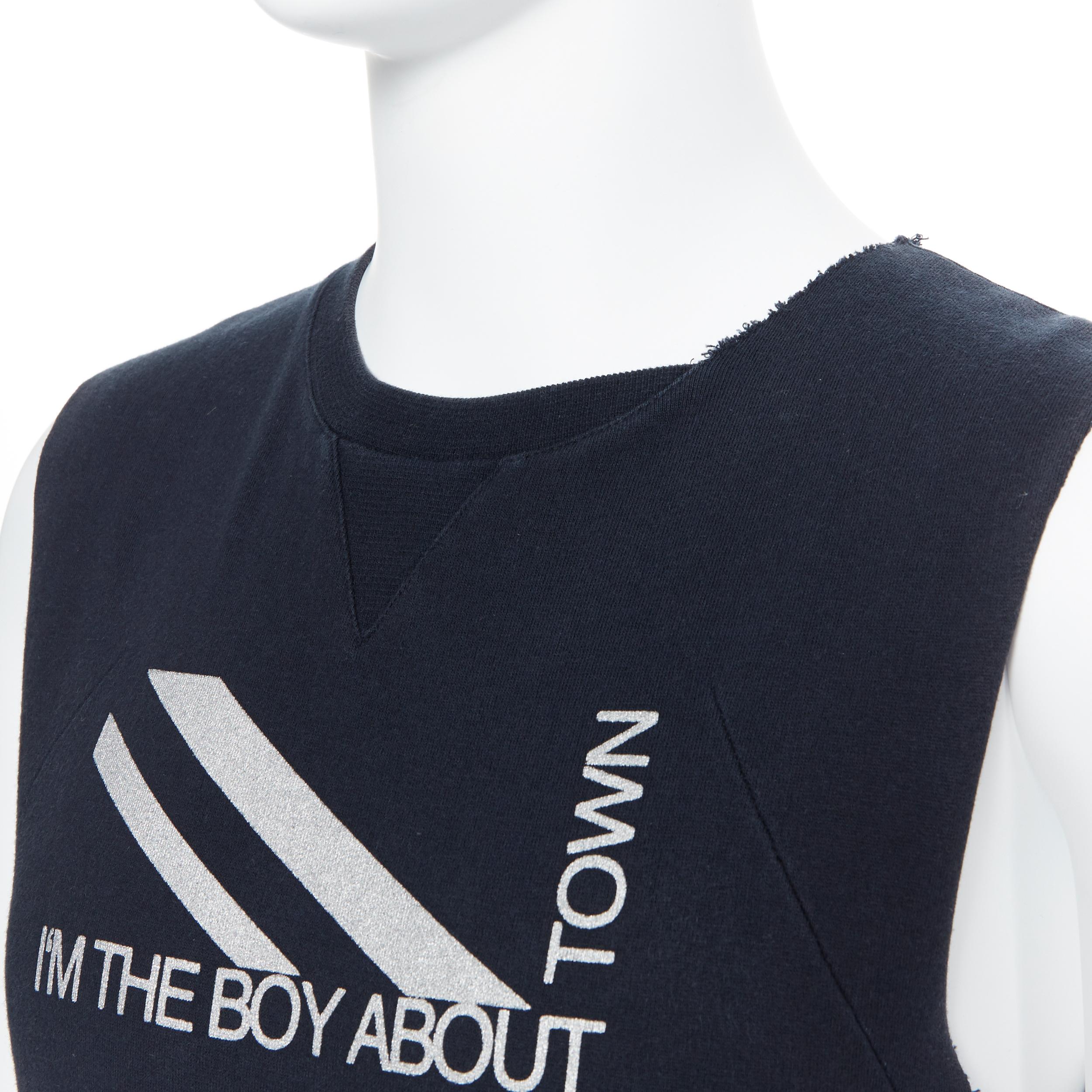 DIOR HOMME black Boy About Town print kangaroo pocket cut sleeveless vest  XS
Brand: Dior Homme
Model Name / Style: Sweater vest
Material: Cotton
Color: Black
Pattern: Solid
Extra Detail: Irregular raw cut collar and sleeves. Sleeveless. Crew neck