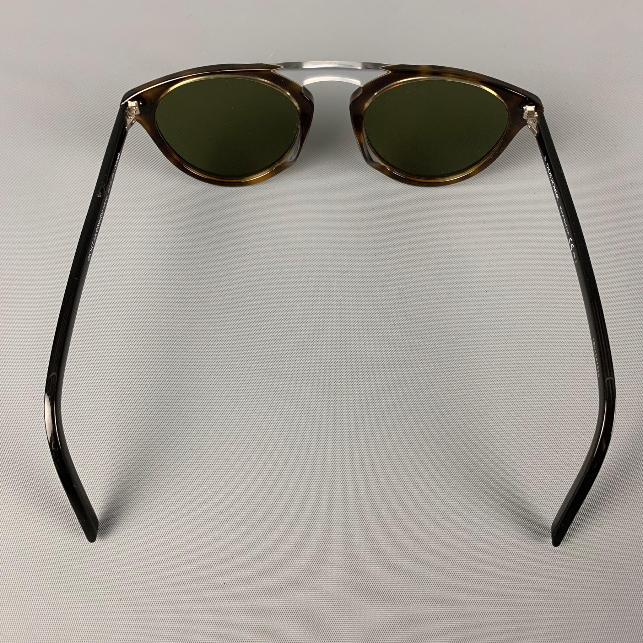 DIOR HOMME 'TAILORING2' sunglasses comes in a black & clear acetate featuring silver tone hardware and tinted lenses. Includes case. Made in Italy.

Very Good Pre-Owned Condition.
Marked: TDU15S7S2N

Measurements:

Length: 14 cm.
Height: 5 in.
 