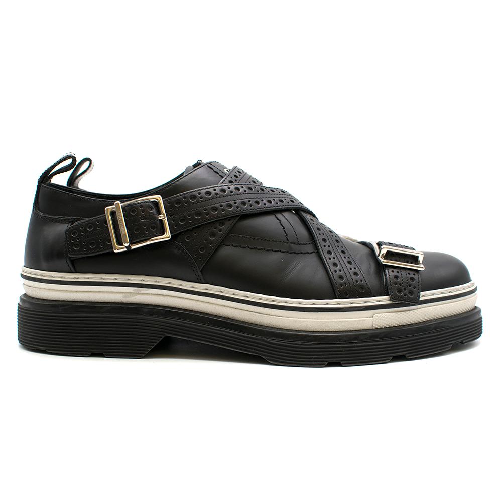 Dior Homme Black Leather Cross Strap Platform Brogues  

-Eyelets and Buckles in silver

- Textured Cross Straps 

-White Trimming above Platform sole

-Made in Italy 

Materials 

Exterior - Leather 
Interior - Leather 
Sole - Rubber 
 