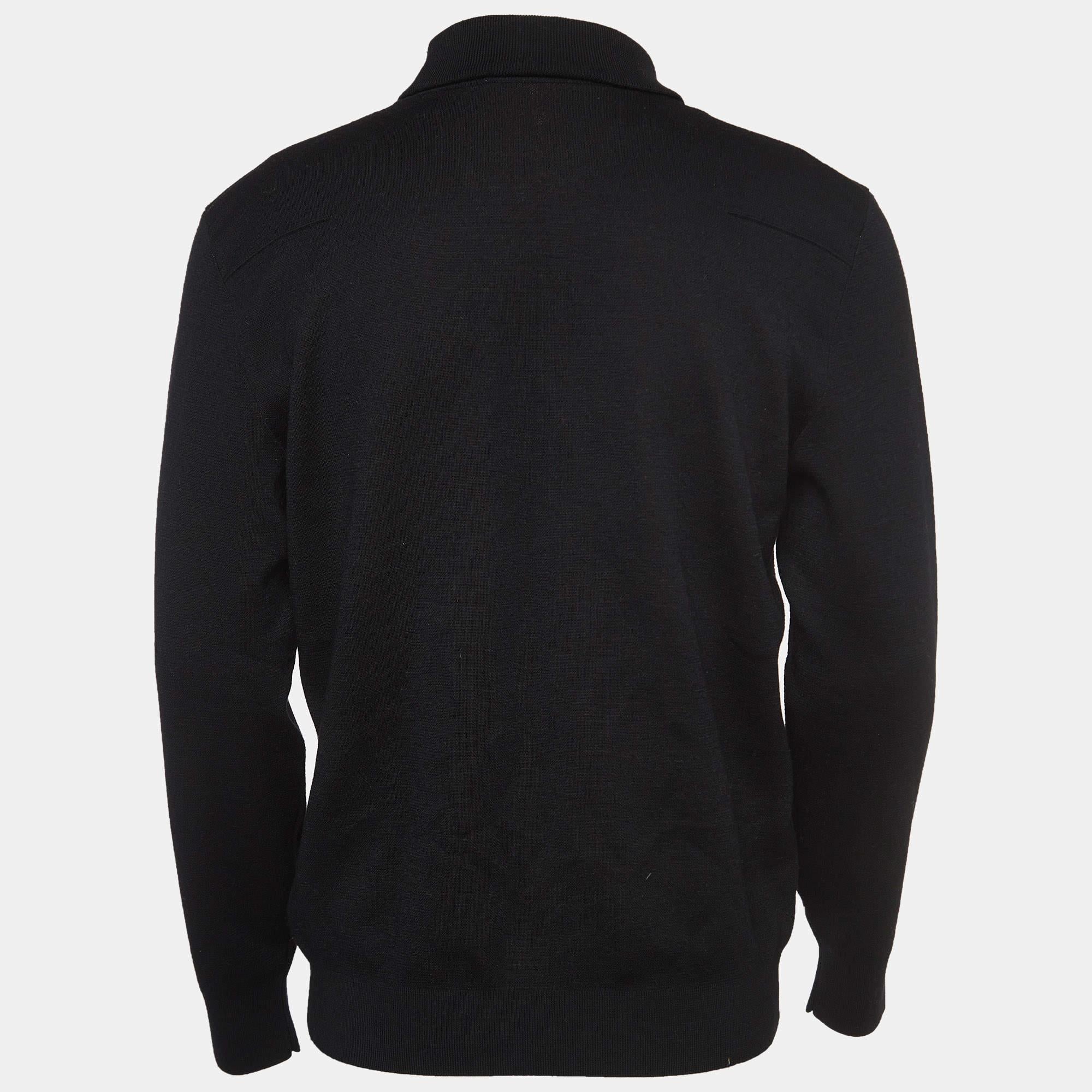The Dior Homme sweater exudes sophistication. Crafted from luxurious wool, it features a sleek black hue, intricate Mr. Dior jacquard pattern, and a timeless turtle neck design. This garment effortlessly combines comfort, style, and the iconic