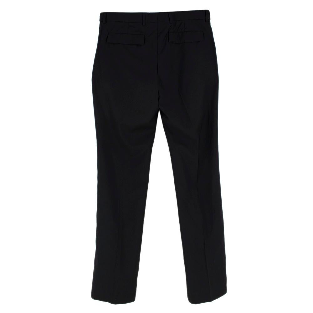 Dior Homme Black Wool Tailored Trousers 

-Made of soft lightweight wool fabric 
-Classic straight cut 
-Zip and hook fastening to the front 
-Button details to the sides
-Pockets to the front
-Pockets to the back 
-Elegant timeless design