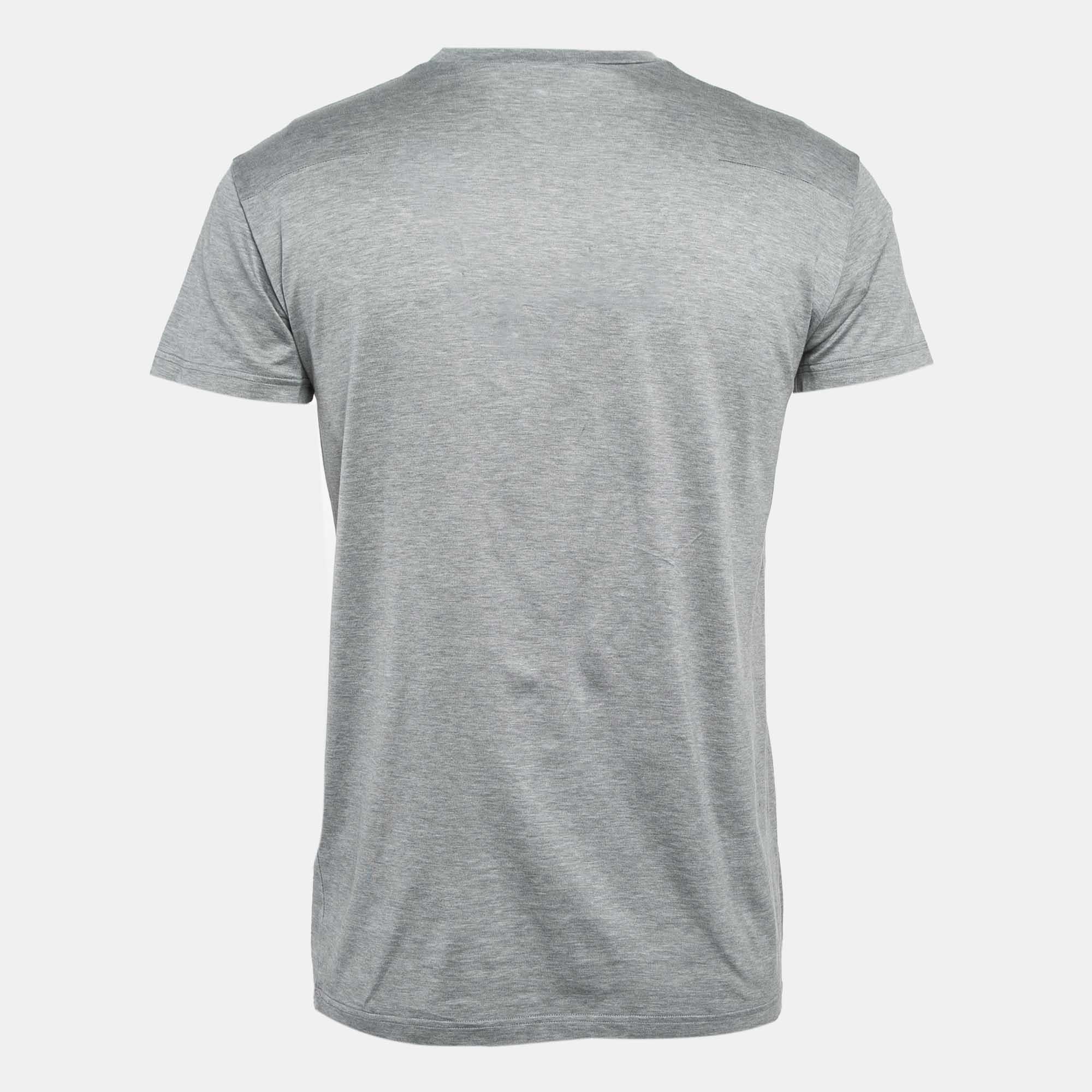 This Dior Homme mens T shirt in grey is cut for a relaxed fit and designed with a crew neckline  short sleeves  and prints on the front. Youll love the comfort and style it brings.