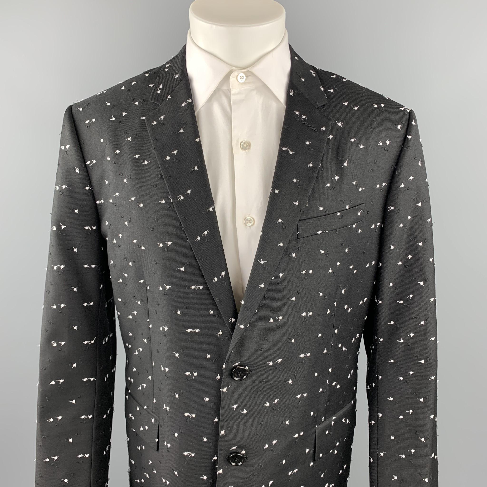 DIOR HOMME Pre-Fall 2017 sport coat comes in a black & white textured wool featuring a notch lapel, flap pockets, and a two button closure. Made in Italy.

Excellent Pre-Owned Condition.
Marked: IT 56

Measurements:

Shoulder: 19 in. 
Chest: 44