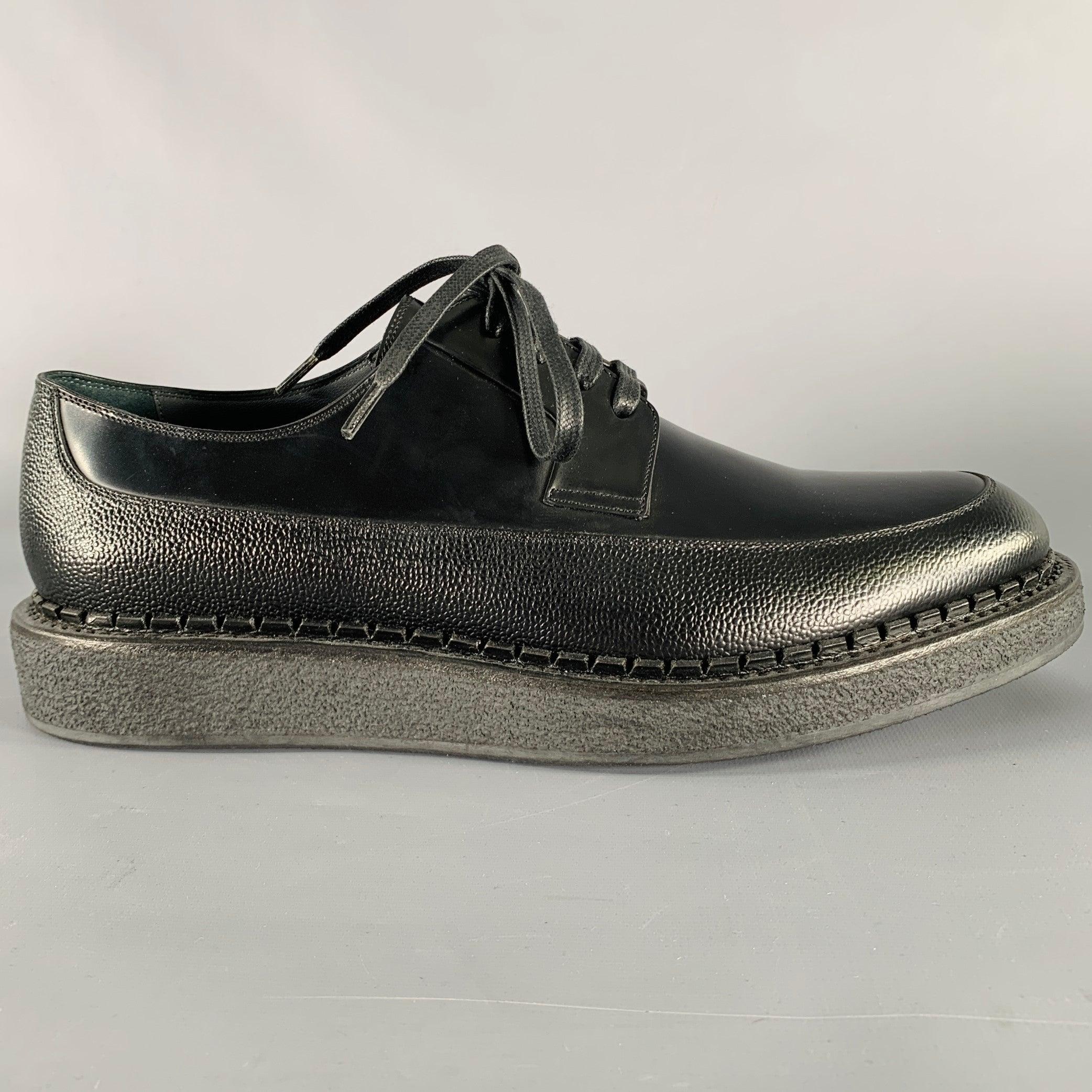 DIOR HOMME shoes
in a black leather fabric featuring a creeper style with chunky rubber sole, mixed textures design, and lace-up closure. Made in Italy.Excellent Pre-Owned Condition. 

Marked:   16HBM 43Outsole: 12 inches  x 4.5 inches 
  
  
 
Sui