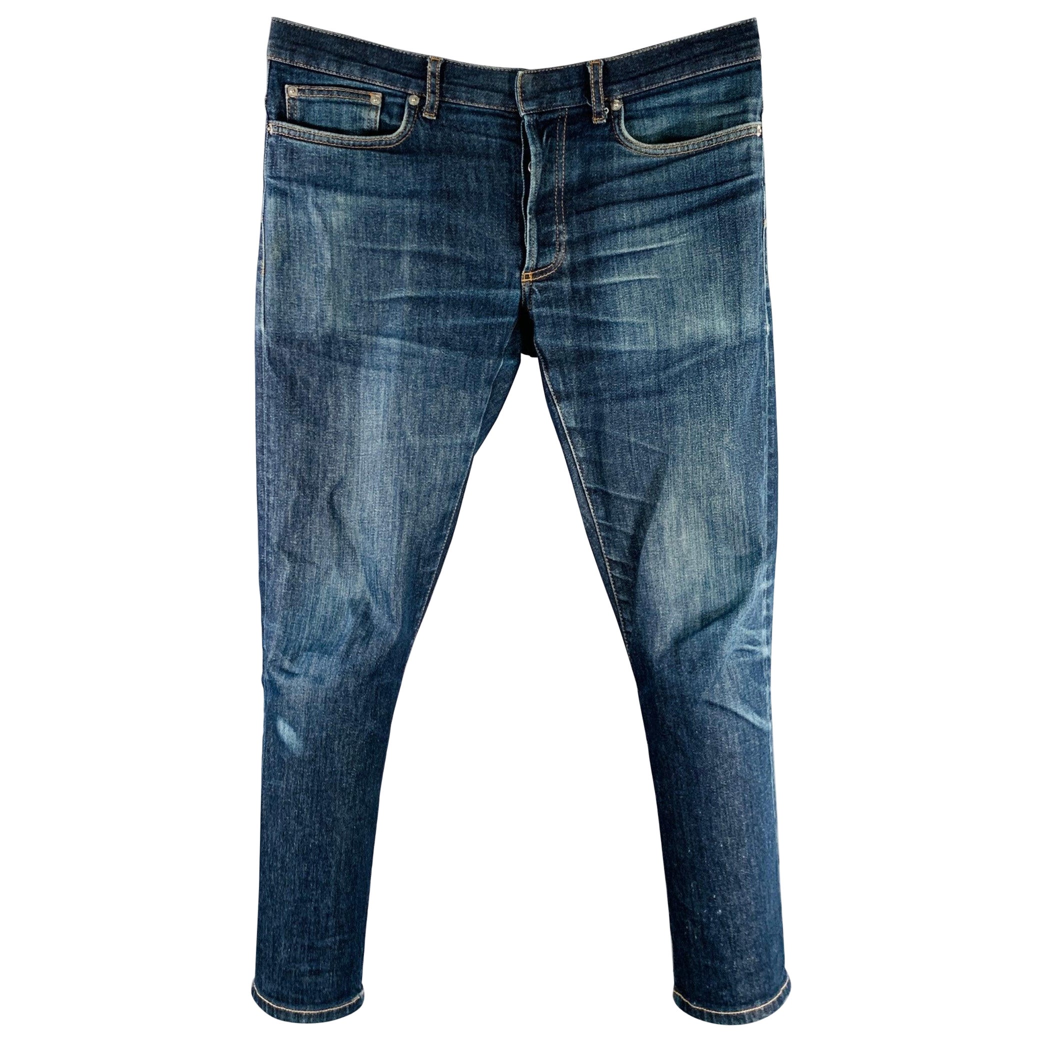 DIOR HOMME - Jean à boutons en coton mélangé bleu délavé taille 31