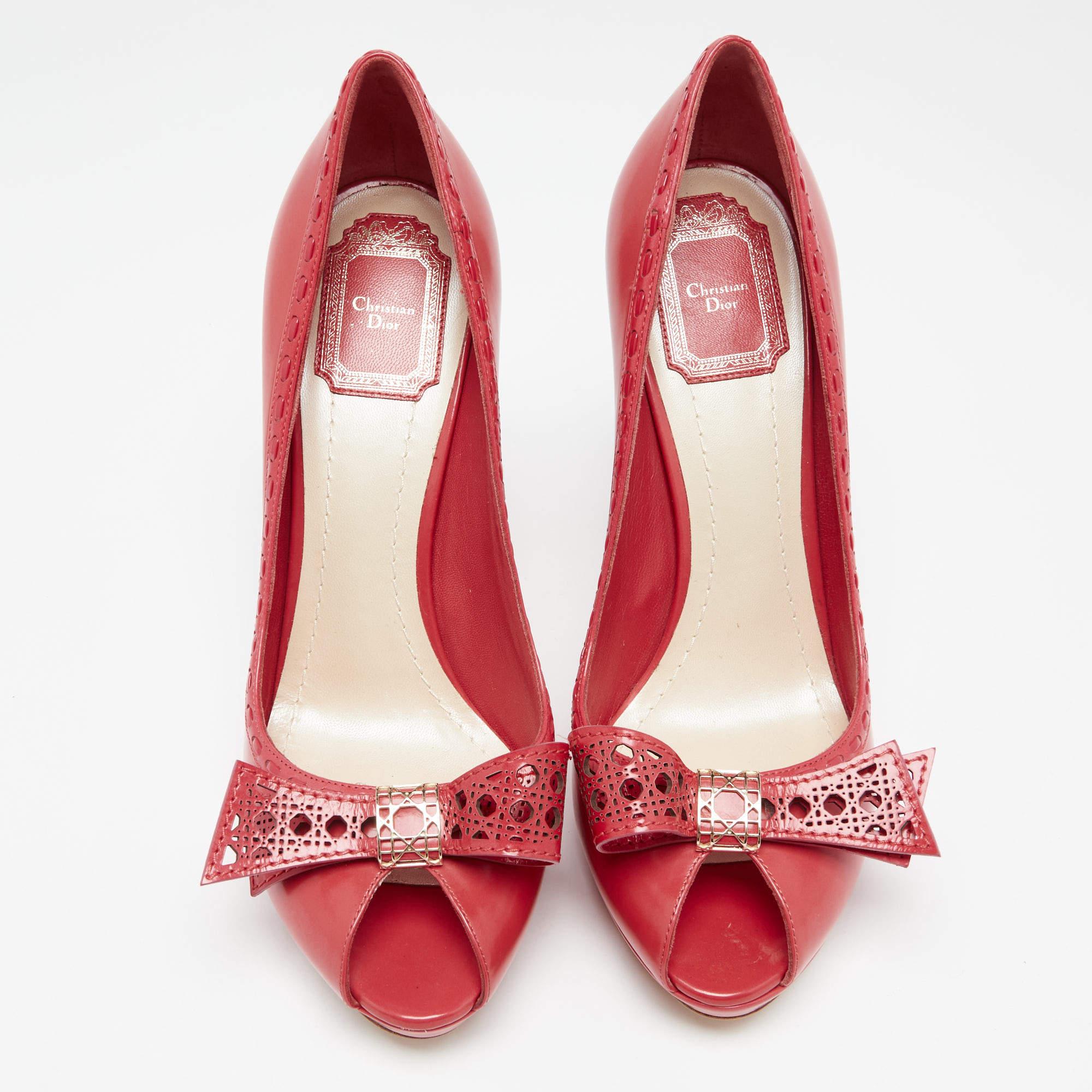 Dior designs ensure to grant you fashion excellence, and these pumps are no different! They are constructed with leather featuring Cannage details and bows on the vamps. These ravishing red pumps are set on stiletto heels and have peep-toes. Team