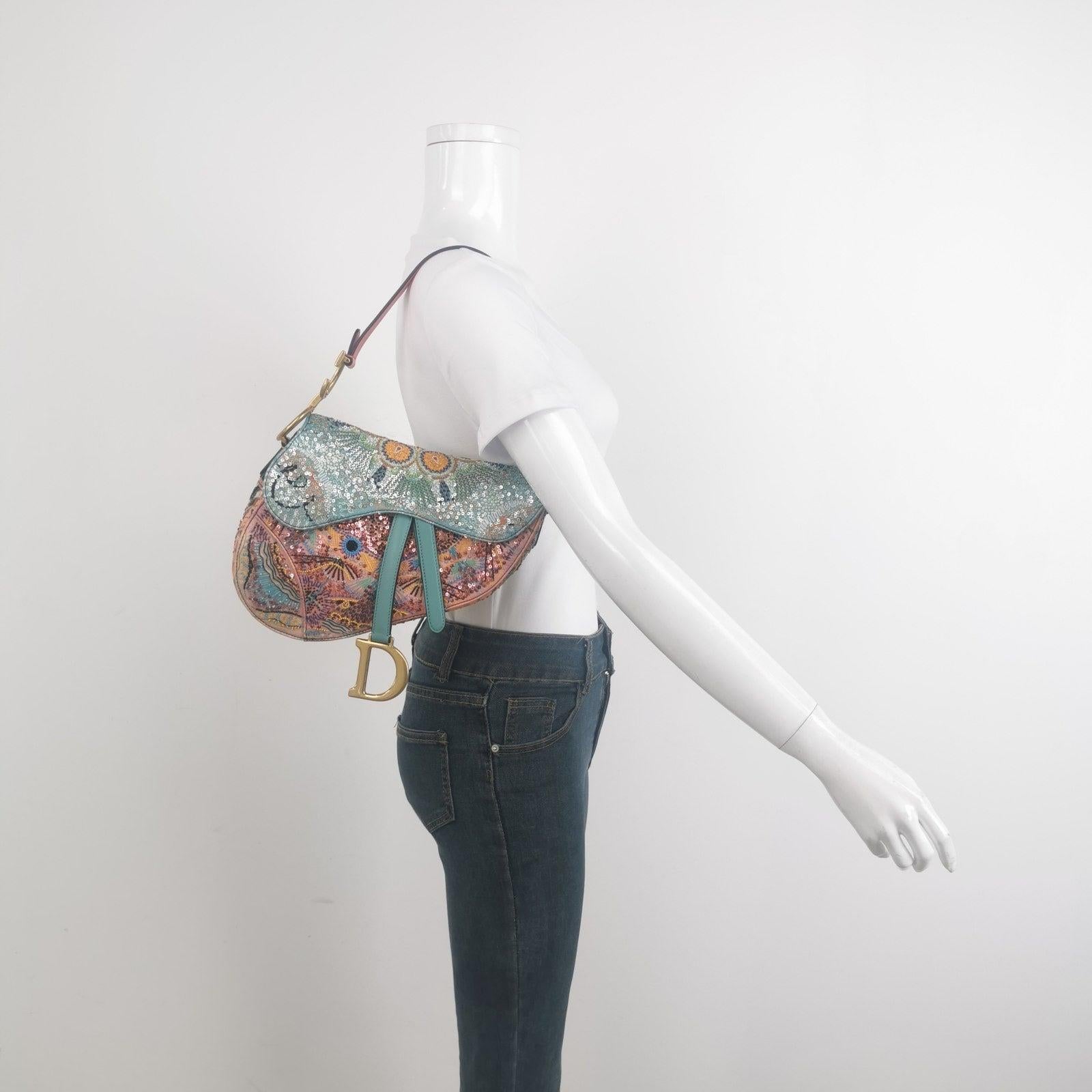 Dior In Lights Saddle Medium Multicolor Beads and Calfskin Leather Shoulder Bag
 These are professional photos of the actual bag offered by Luxbags.
 Crafted with inspiration from the dazzling light festivals of sunny southern Italy, this saddle bag