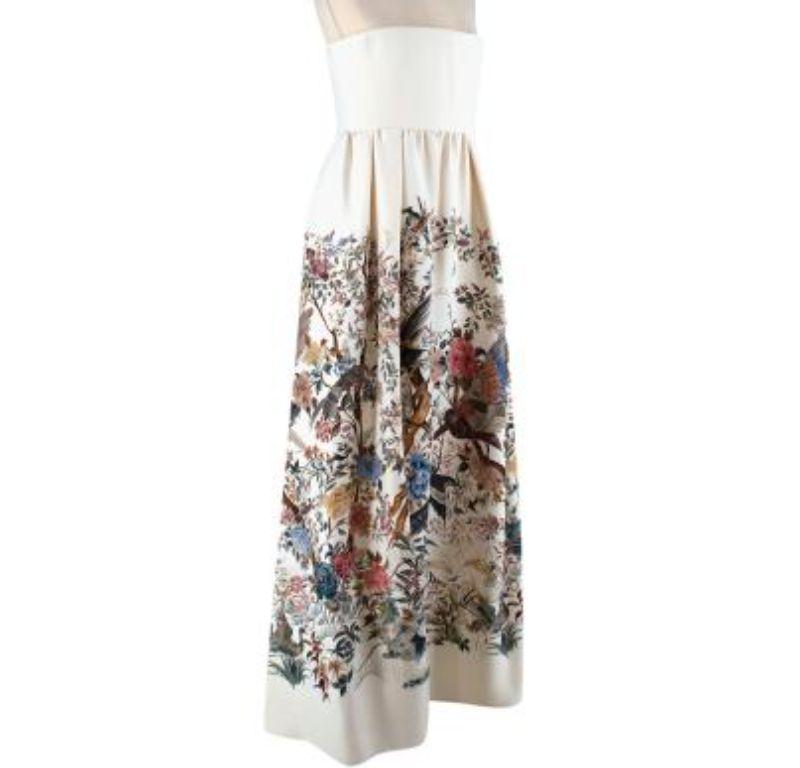 Dior Ivory Jardin d'Hiver Strapless Gown

- Corset bandeau top
- Frilled skirt
- Part lined
- Floral and bird patterns throughout the skirt
- Concealed zip fastening on side
- Two concealed pockets on each side

Material
77% Wool
23% Silk
Lining: