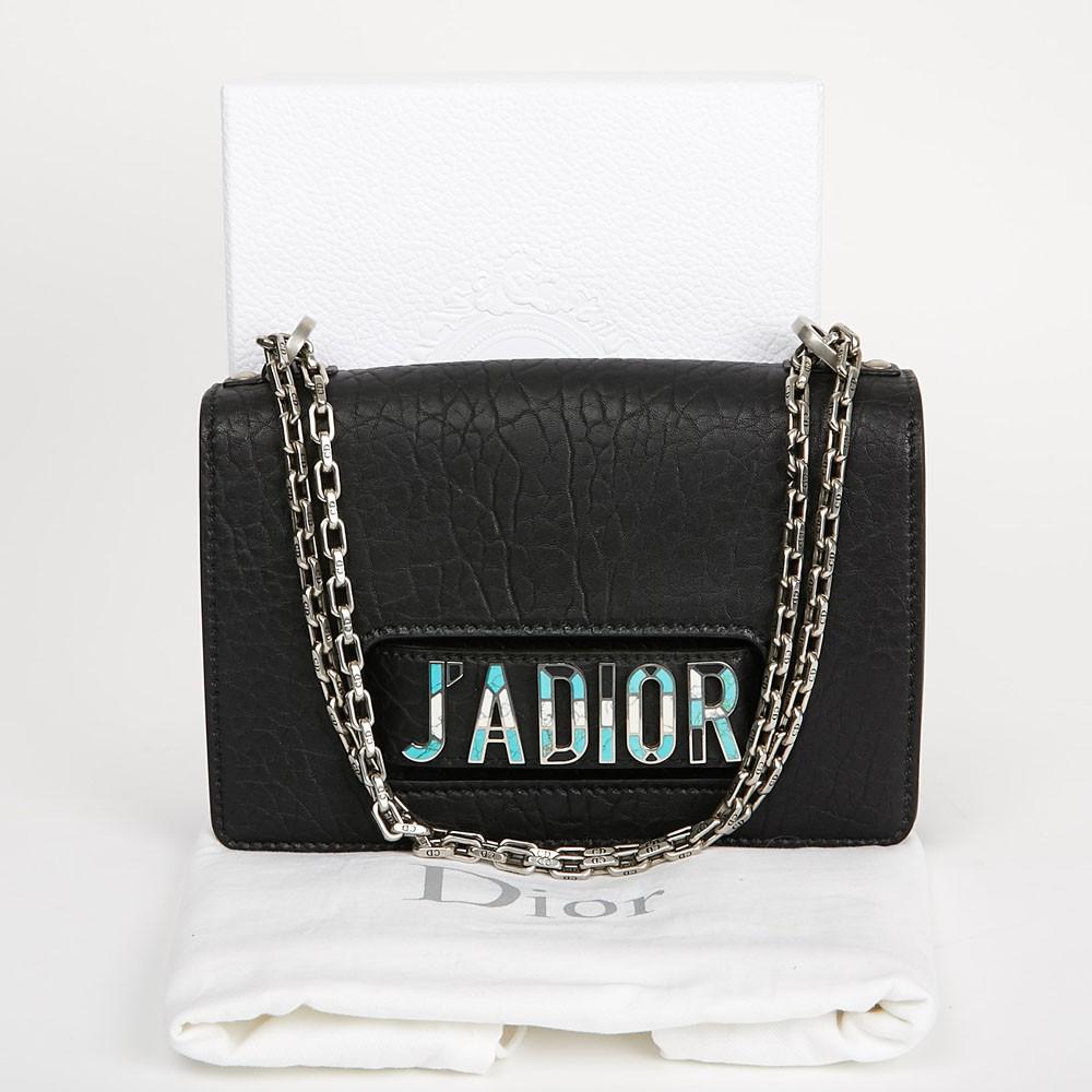 Beautiful Dior bag from the J'Adior collection. It is made of lambskin leather with a crumpled effect. The trimmings are in silvery metal. The links of the chain are all signed CD and it can be worn single or double. It is lined in black suede,