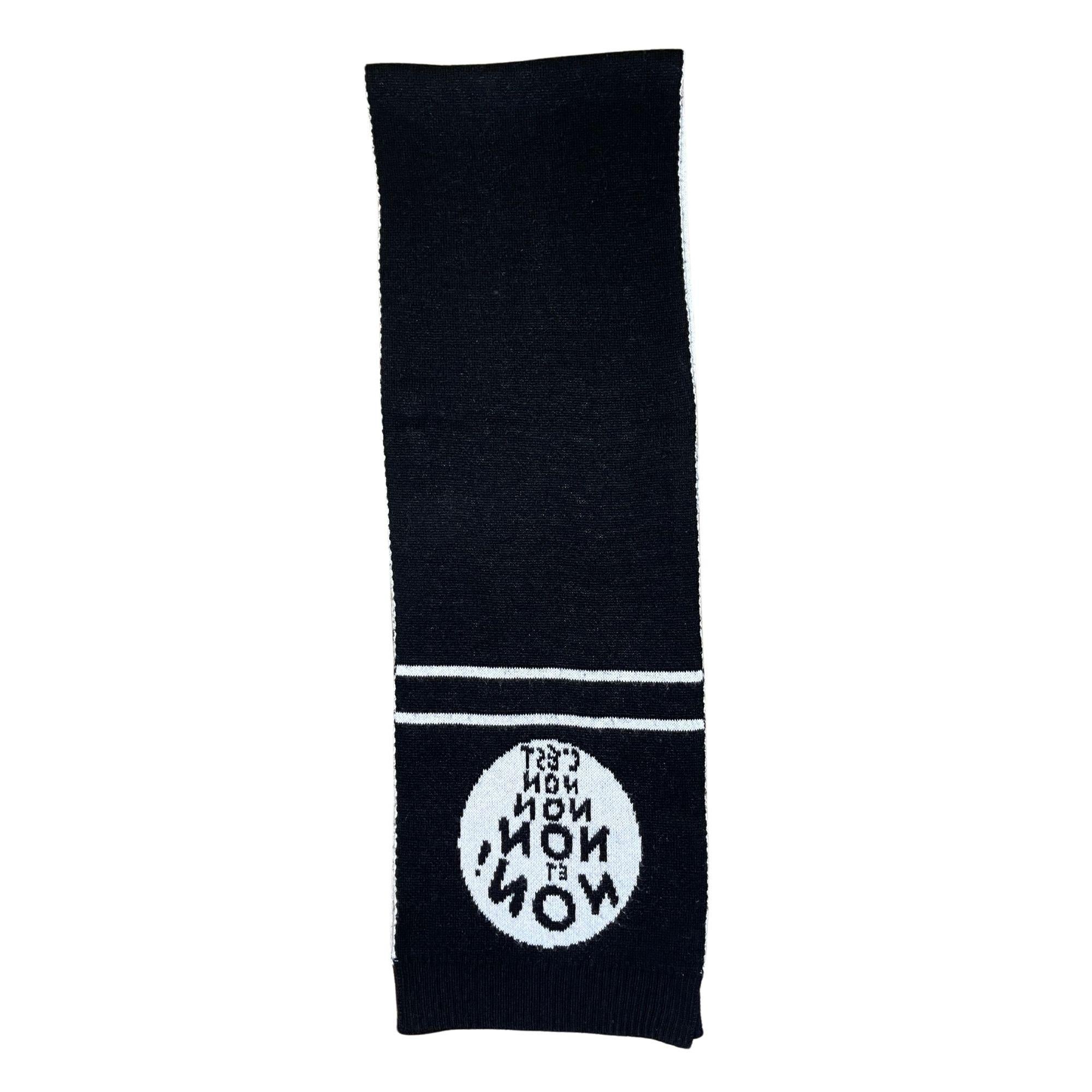 Classic Dior black and white scarf. Very soft and a perfect addition to any monochromatic winter look!

COLOR: Black
MATERIAL: Cashmere
MEASURES: H 13.5” x L 80”
CONDITION: Good - pilling, pulled threads, very clean and minimal signs of use.

Made