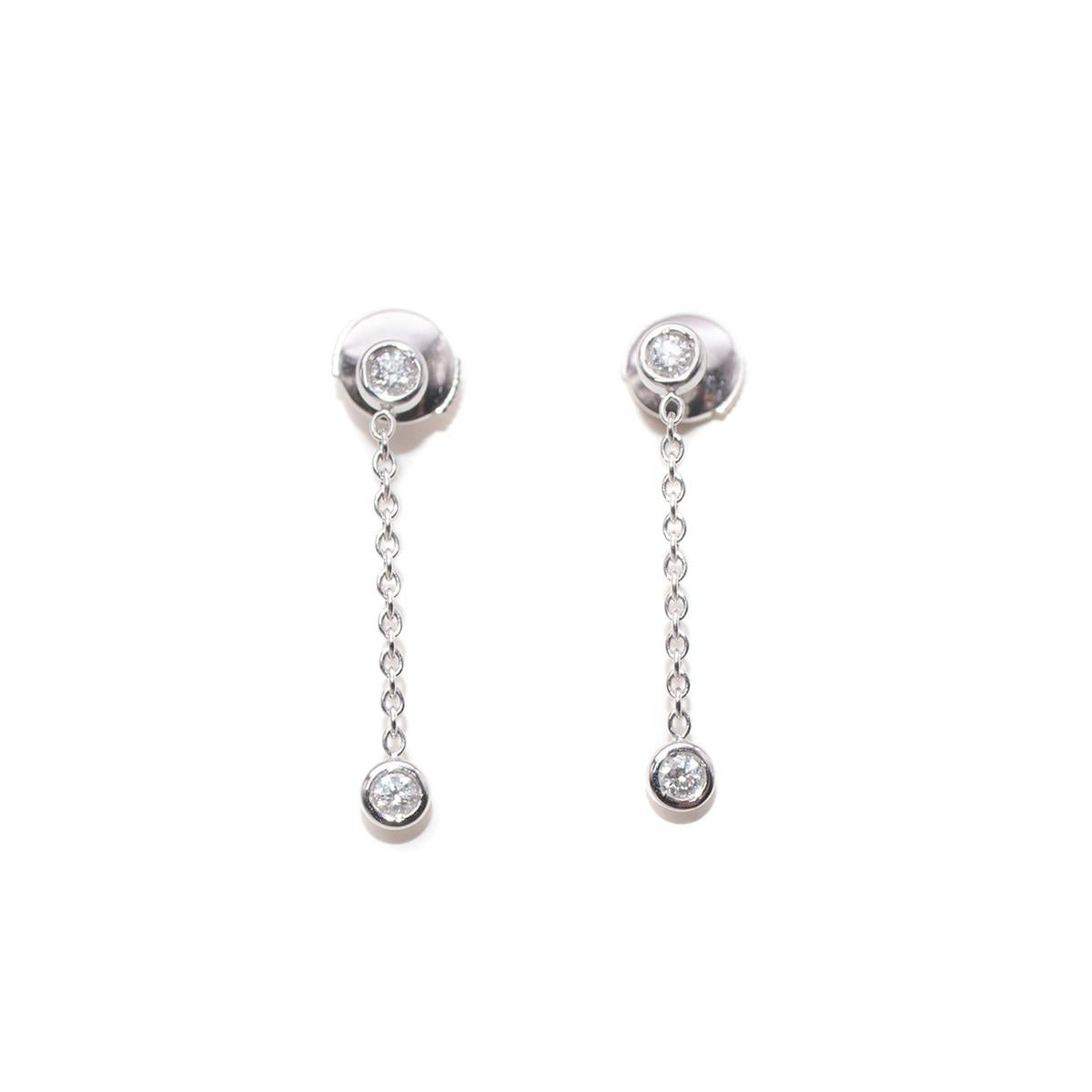 Dior Joaillerie 18k White Gold Chain Drop Diamond Stud Earrings

- 18k white gold earrings feature a long chain drop crafted from fine links adorned with a tiny brilliant-cut diamond in the heart of the stud, and base of the drop chain
- Butterfly