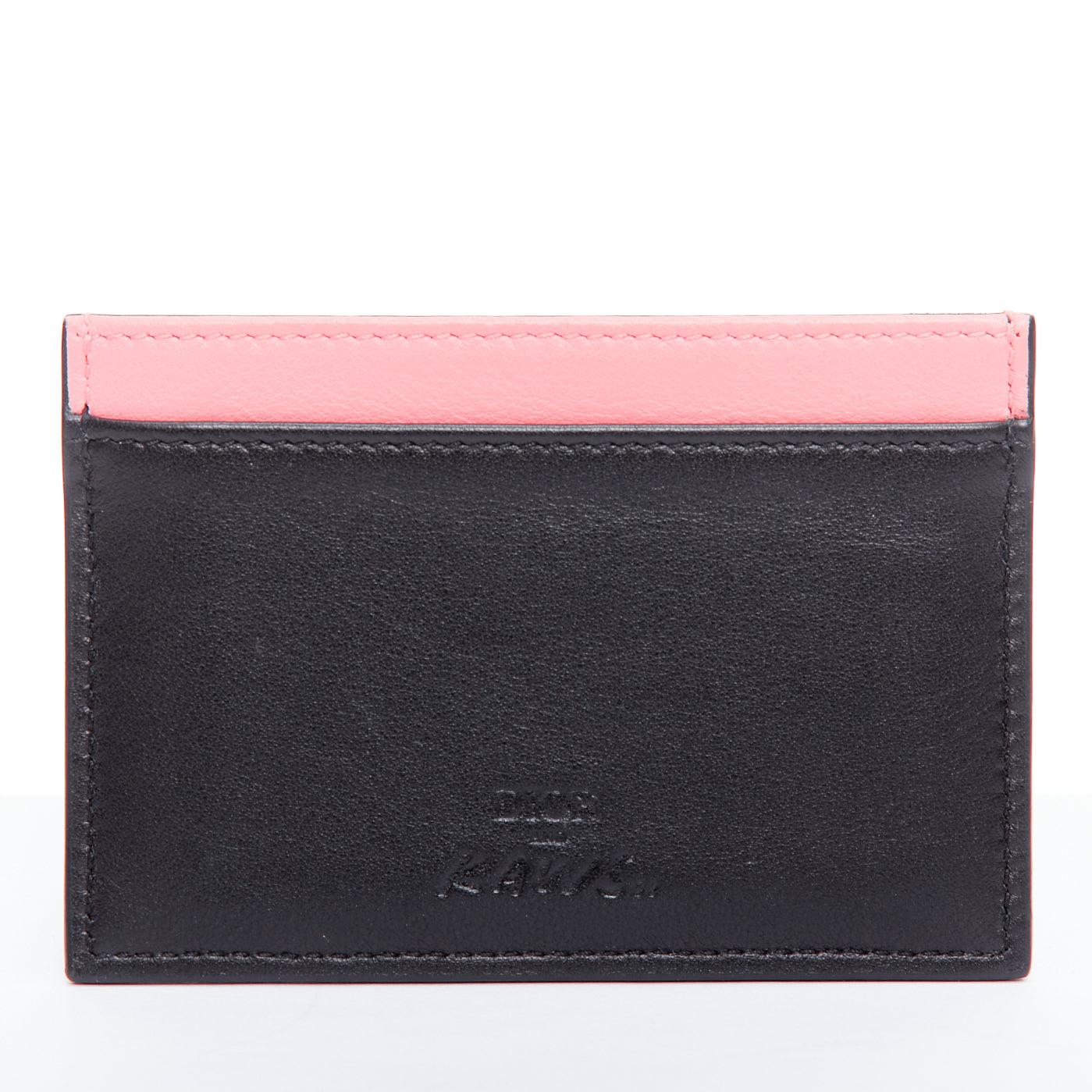 DIOR KAWS 201k pink bee XX black leather cardholder
Reference: LNKO/A02473
Brand: Dior
Designer: Kim Jones
Collection: Kaws 2018
Material: Leather
Color: Black, Pink
Pattern: Animal Print
Lining: Pink Leather
Made in: Italy

CONDITION:
Condition: