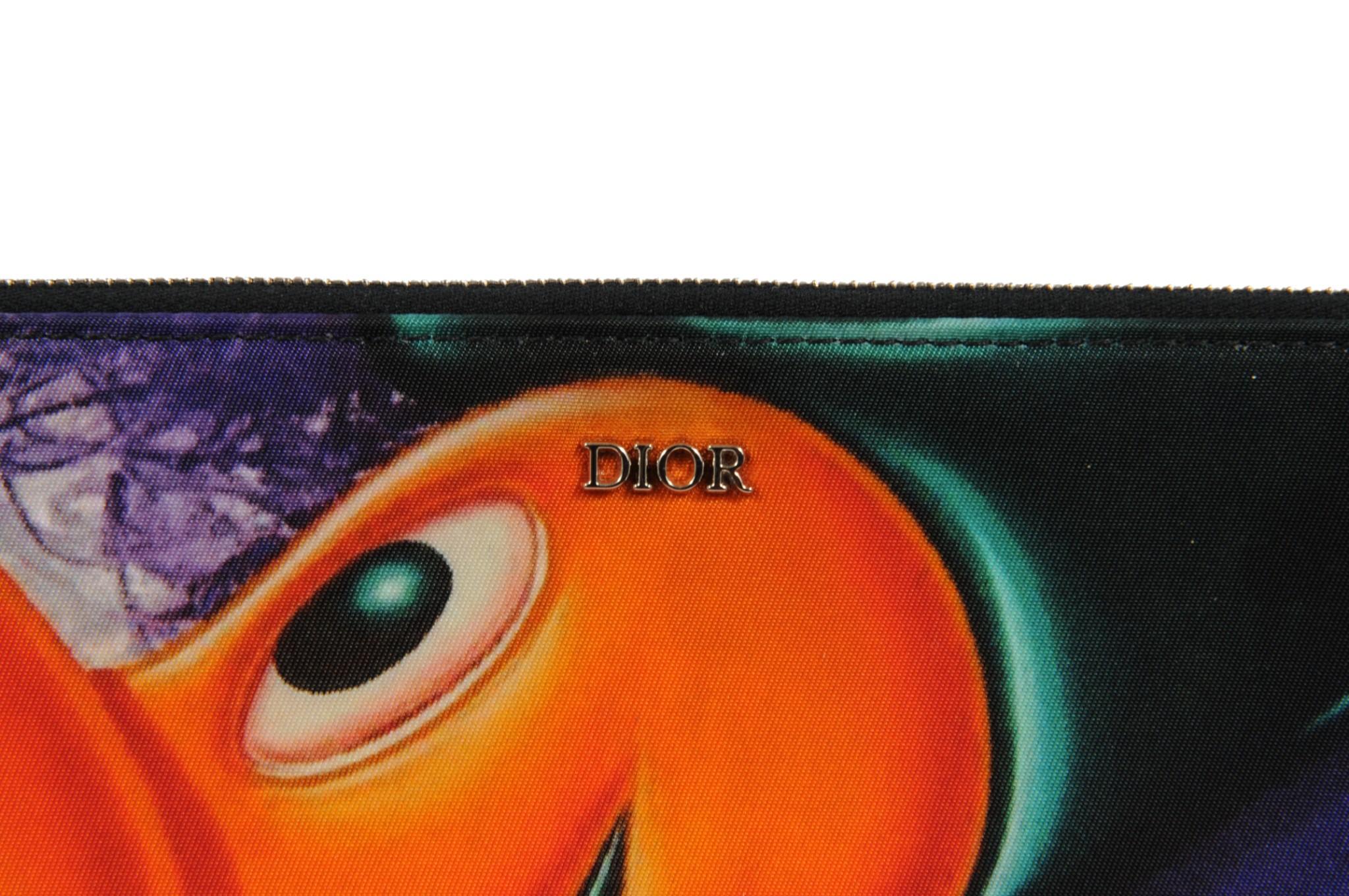 - Collaboration with Kenny Scharf

- Zipped closure



Condition: 

The pouch is in overall great condition with no major imperfections 



Measurements: ( Approximately In Inches ) 

9.75 L x 6.75 H
