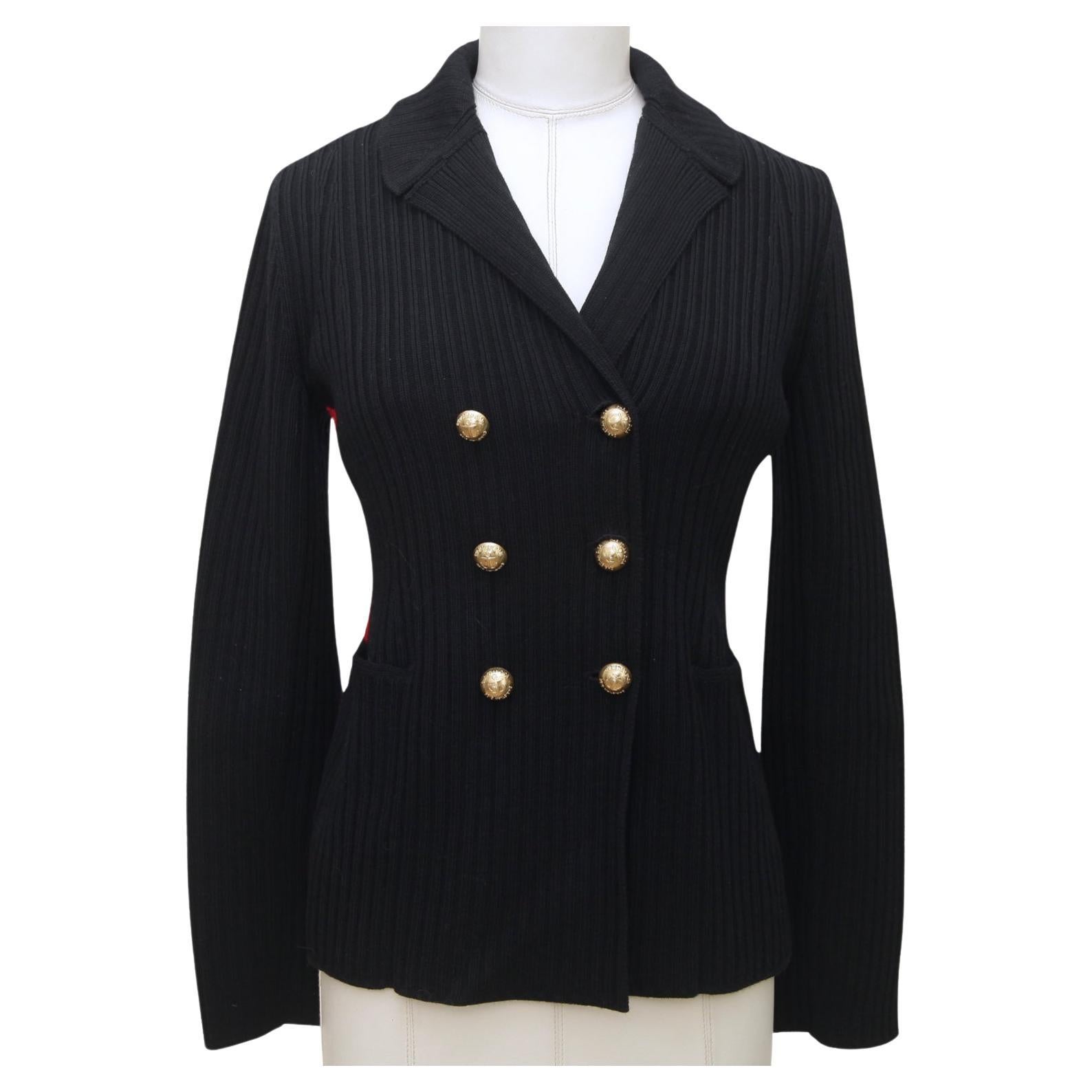 GUARANTEED AUTHENTIC DIOR NAVY RED RIBBED KNIT BAR JACKET
Retail $3,900 + tax

Design:
- Iconic double breasted bar jacket in a ribbed navy blue knit.
- Red stripe at sides.
- Notched collar.
- Double breasted gold-tone hw buttons.
- Dual front
