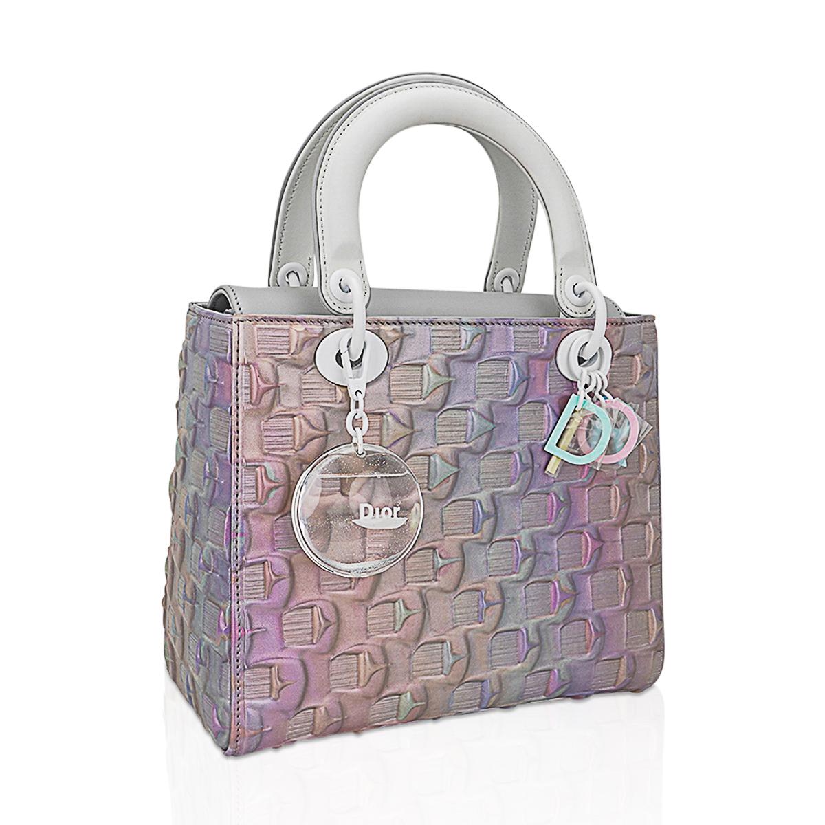 Mightychic offers a Christian 6th Edition Dior Lady Art bag featured in softly irridescent pastels ivoking the natural movement of the sea.
Designed by Daisuke Ohba as part of a collaboration between Dior and 12 artists to mark the release of the