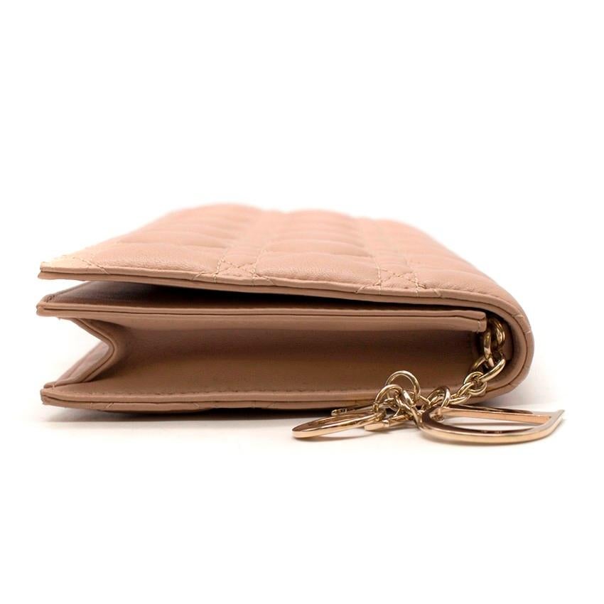 Dior Lady Dior Cannage Leather Nude Clutch

- Nude, signature quilted leather
- Detachable gold-tone metal chain shoulder strap 
- Signature gold-tone metal logo charm
- Magnetic fastening front flap
- Internal card holder
- Beige canvas lining