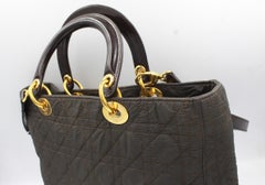 Dior Lady Dior handbag in brown canvas and leather finishes, with shoulder strap