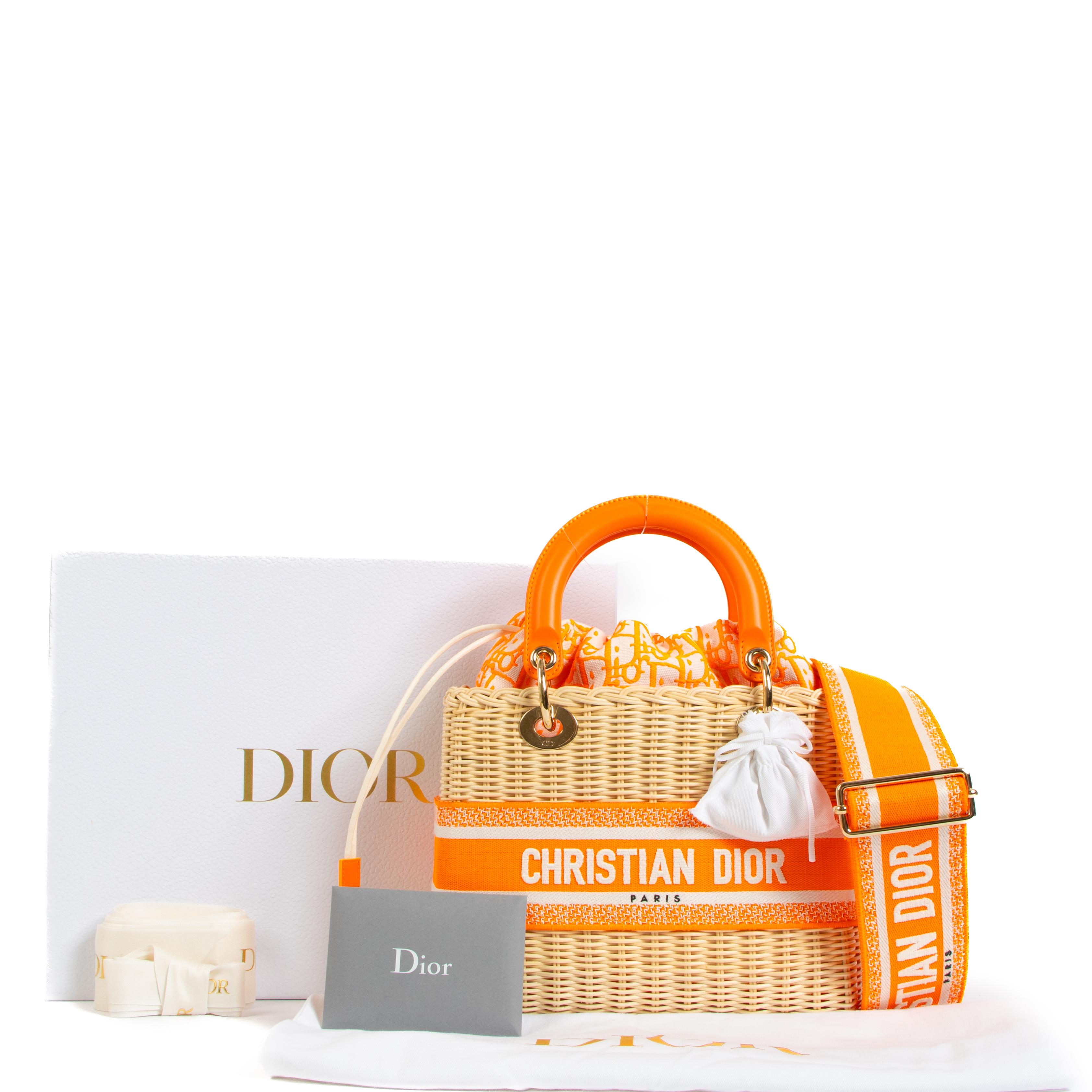Are you still looking for the perfect summer bag? We've found it! 

This Dior Lady Dior bag is crafted from wicker and features neon orange details. It is a bag that can be worn to many occasions, like the beach or a fancy dinner. This bag elevates
