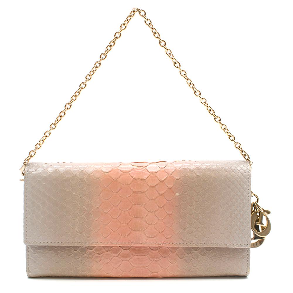 Dior Lady Dior Ombre Python Wallet On Chain

Rectangular shaped clutch 
Pink and grey ombre design 
Gold chain 
Fold snap closure
Zip closure pocket in interior 
Interior pocket
Front slip pocket
Card holders
Dior logo gold charms
Gold hardware
Dust