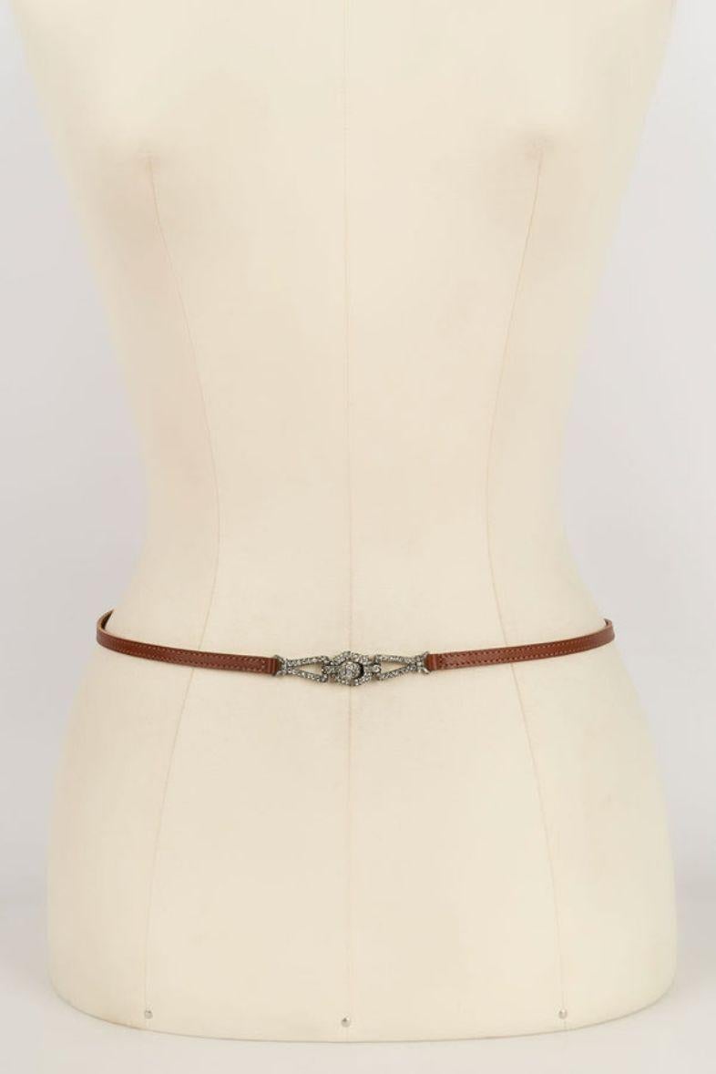 Dior -Fine brown leather belt with silver metal buckle.

Additional information: 
Dimensions: Length: 70 cm
Condition: Very good condition
Seller Ref number: ACC20
