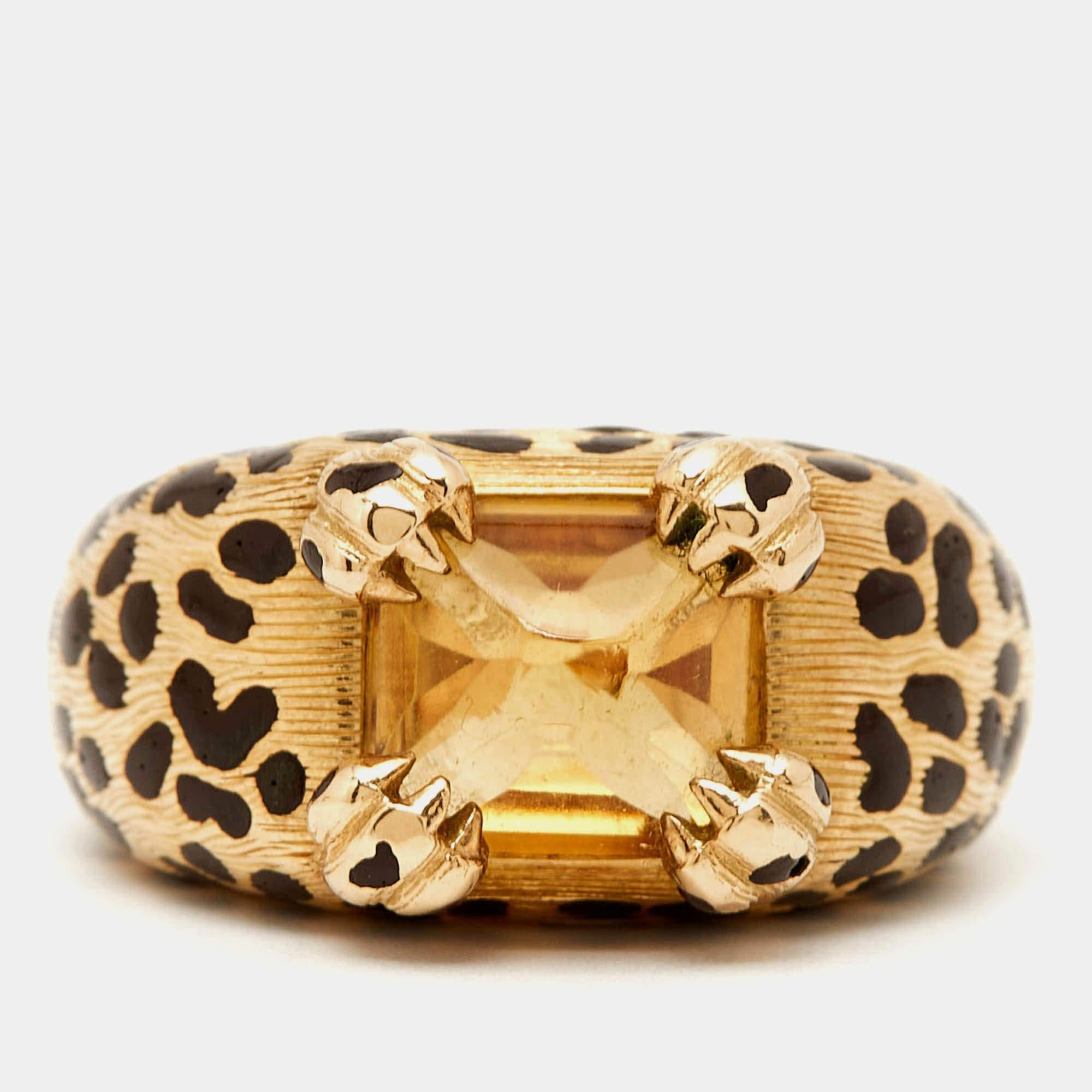 The Dior ring crafted from 18k yellow gold showcases a captivating citrine gemstone. This luxurious piece is accented with intricate leopard motifs and fine lacquer work blending timeless charm with a bold modern aesthetic. A statement of refined