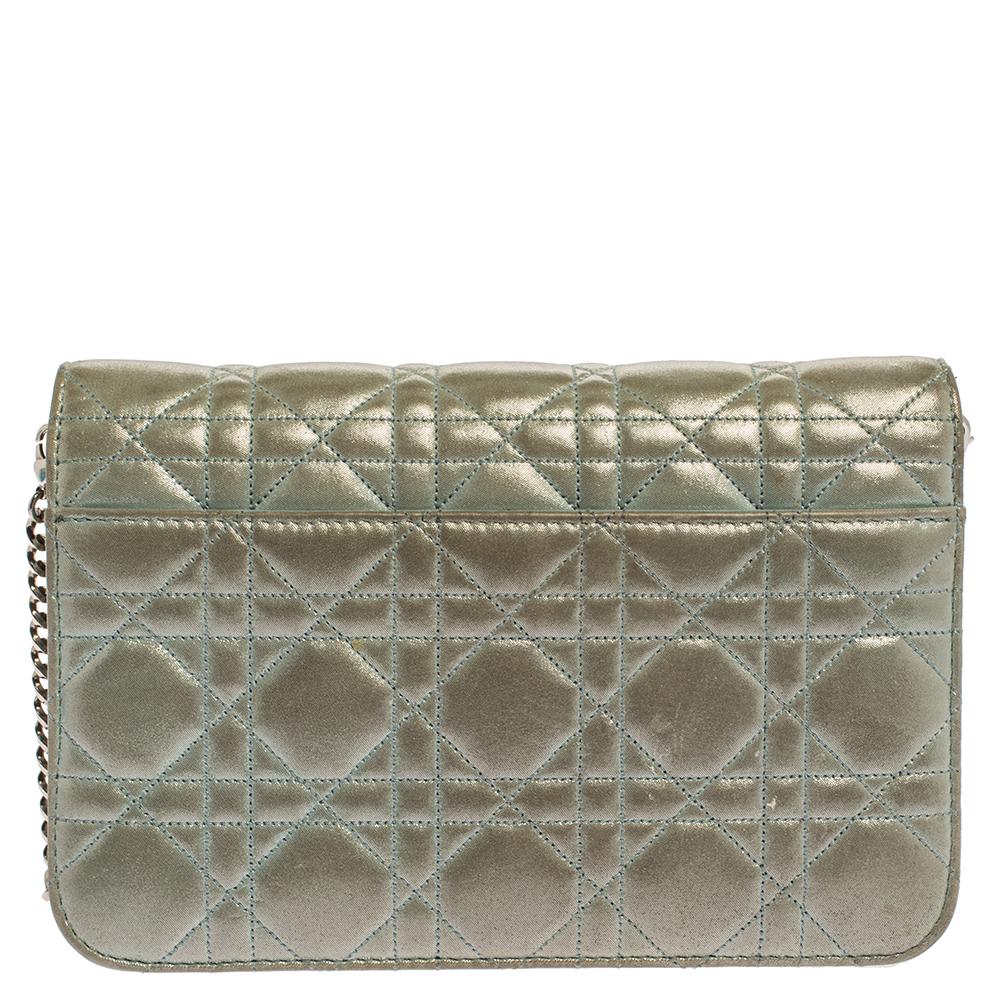 Flap bags like this Miss Dior will never go out of style. Crafted from shimmering leather, this Dior flap bag features a light blue Cannage exterior and a chain strap. The front flap has a Dior lock that opens to a leather-lined interior with enough