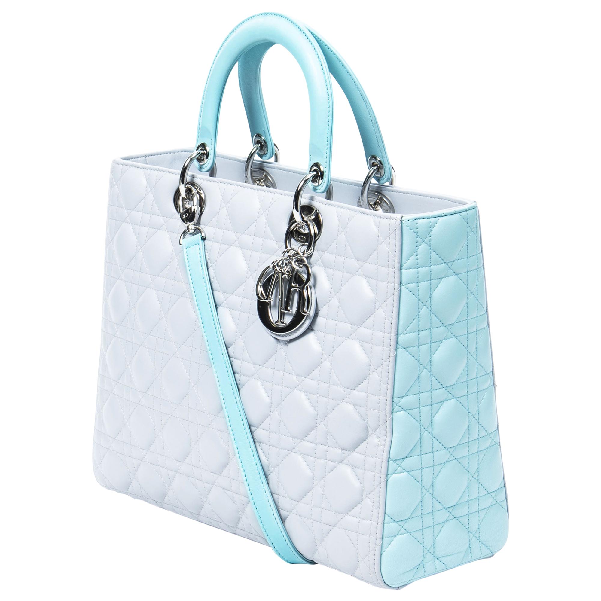 Meet the Dior Light Gray/Light Turquoise Large Bicolor Lady Dior, a chic statement piece for the sophisticated fashionista. Crafted from luxurious cannage lambskin leather, its light gray and light turquoise bicolor design radiates elegance. Adorned