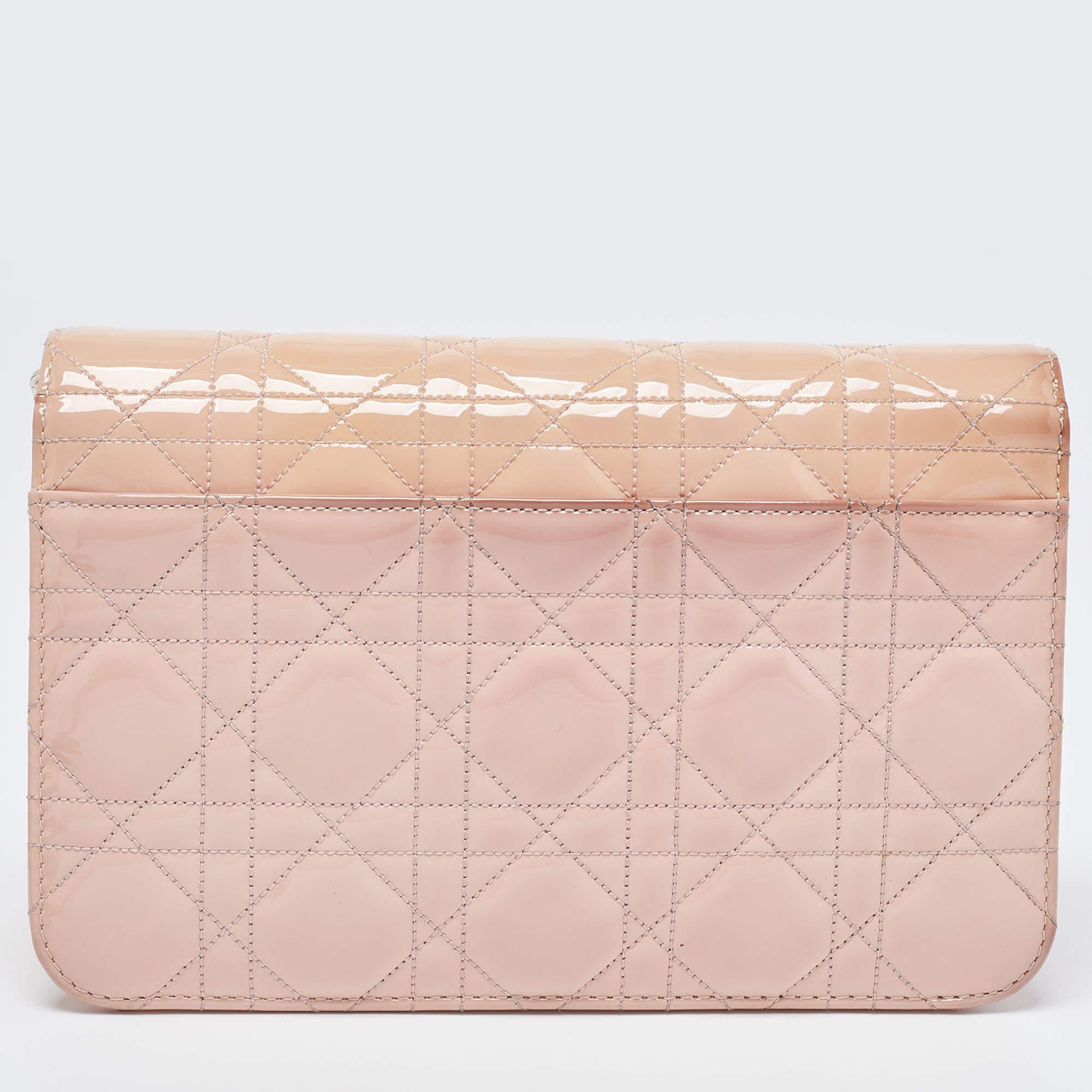 Enriched with striking elements, the appeal of this Dior Promenade bag is truly ever-lasting. The nylon and leather lined interior of this light pink creation has ideal space to accommodate your valuables, and the front flap is equipped with branded