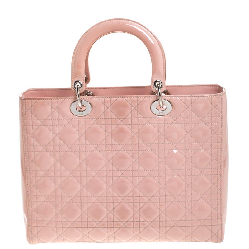 The Lady Dior tote is a Dior creation that has gained recognition worldwide and is today a coveted bag that every fashionista craves to possess. This pink tote has been crafted from patent leather and it carries the signature Cannage quilt. It is